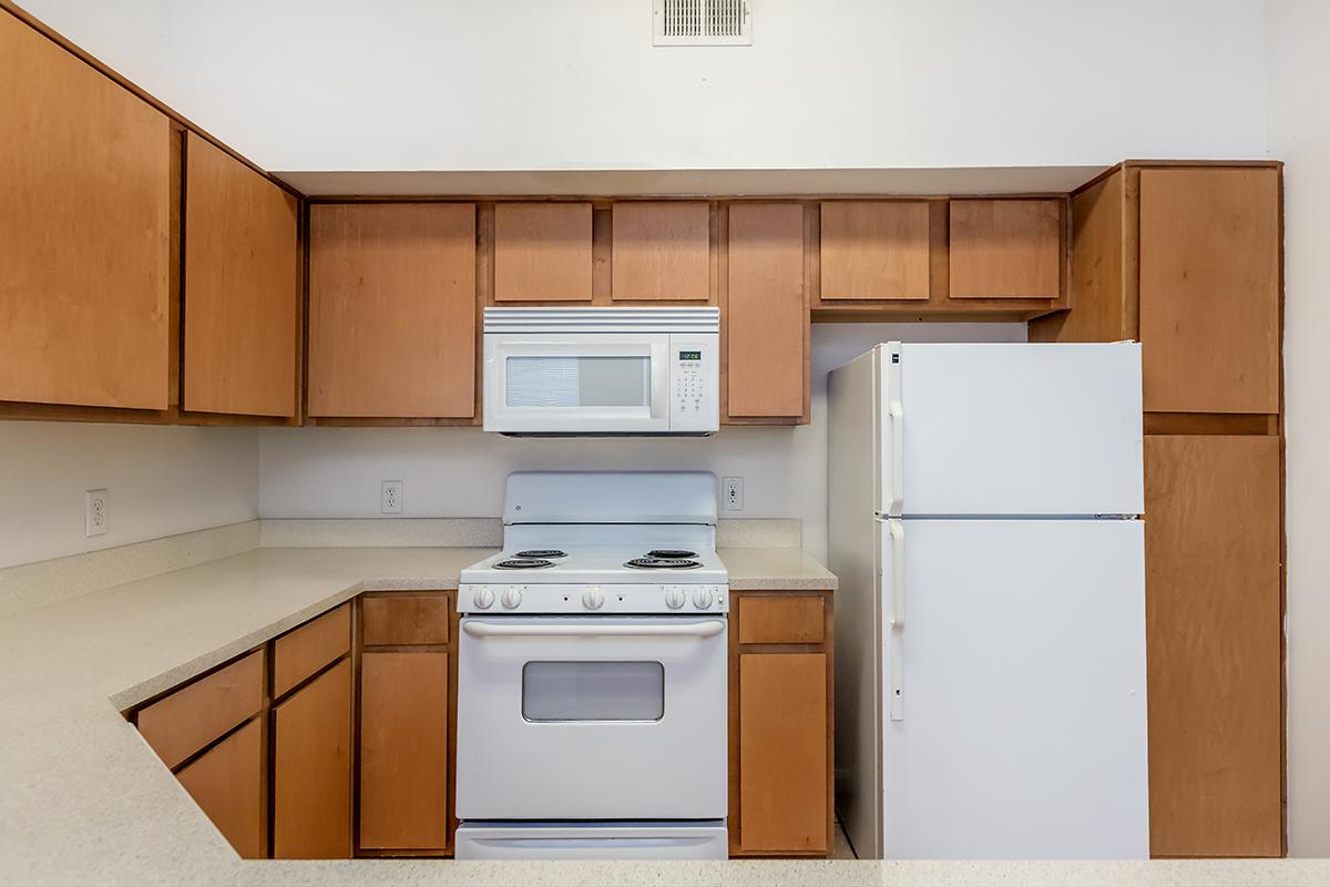 a kitchen with a stove top oven sitting inside of a refrigerator