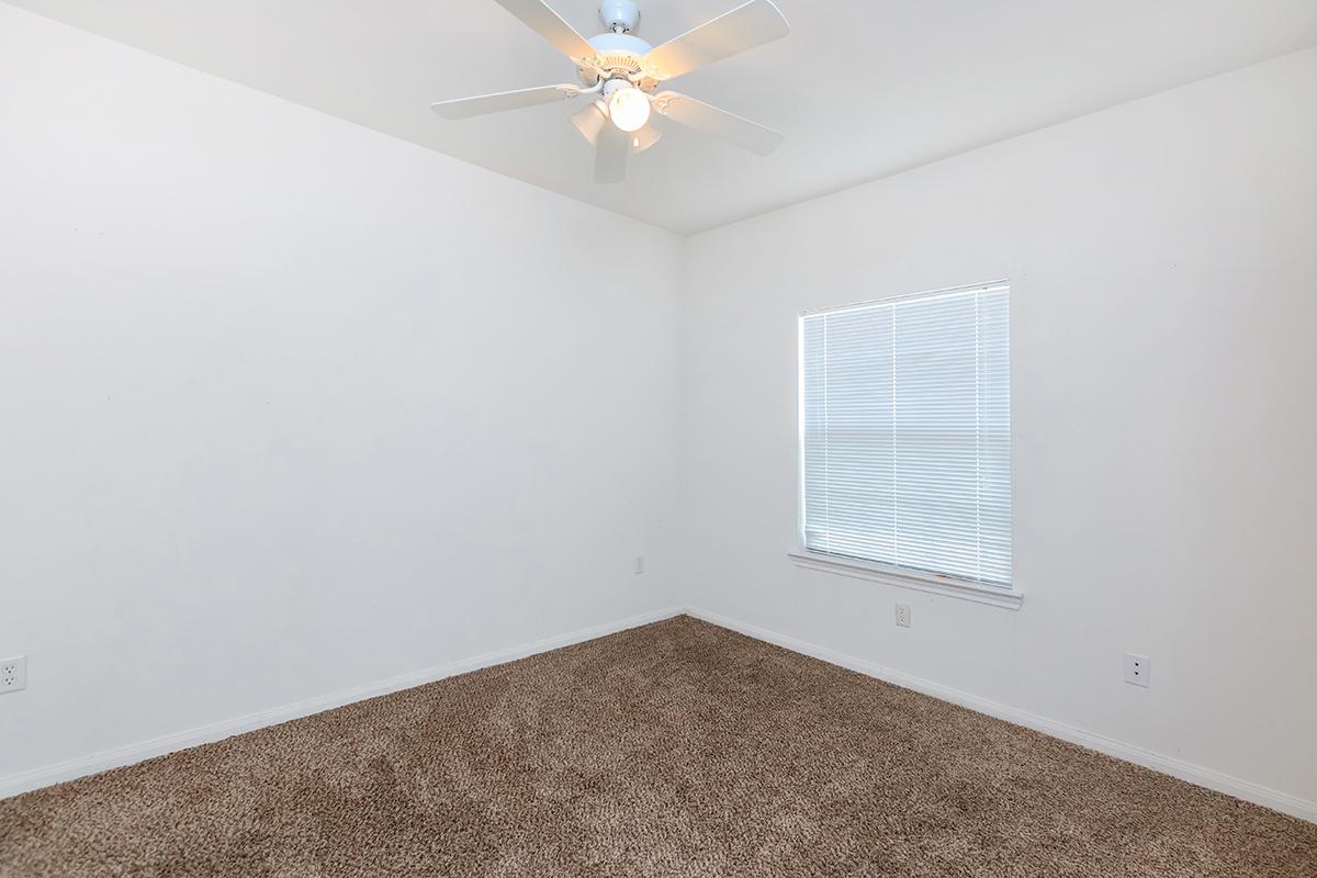 a bedroom with a large window