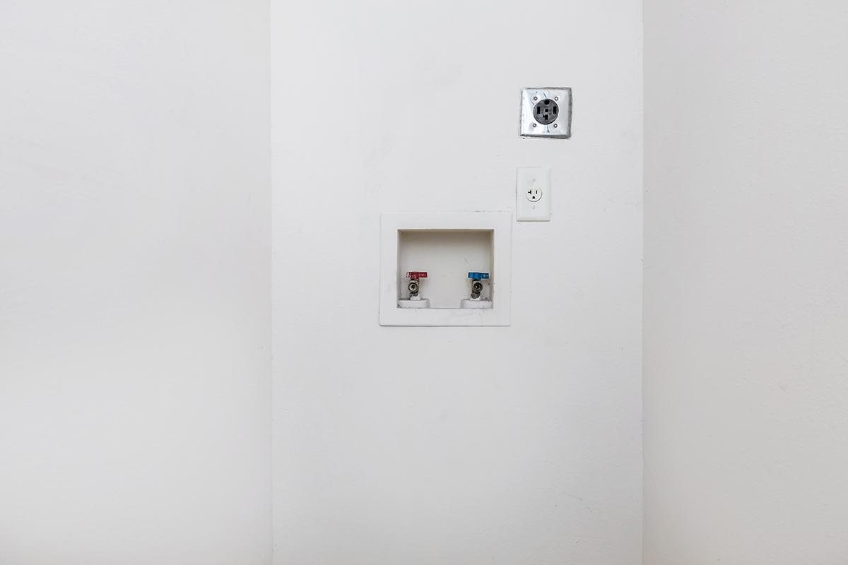 a white refrigerator freezer sitting in a room