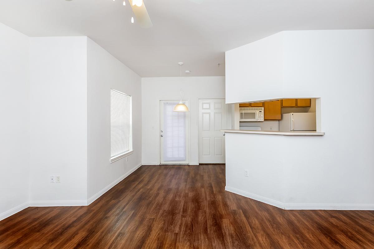 a large empty room with a hard wood floor