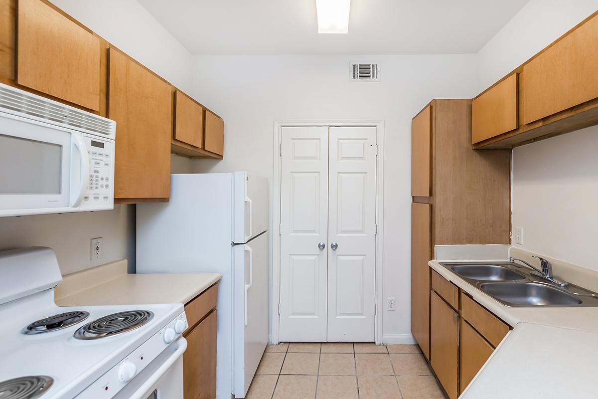 a kitchen with a stove top oven