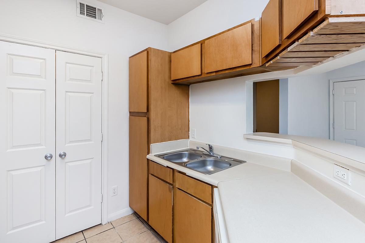 a kitchen with a sink and a window