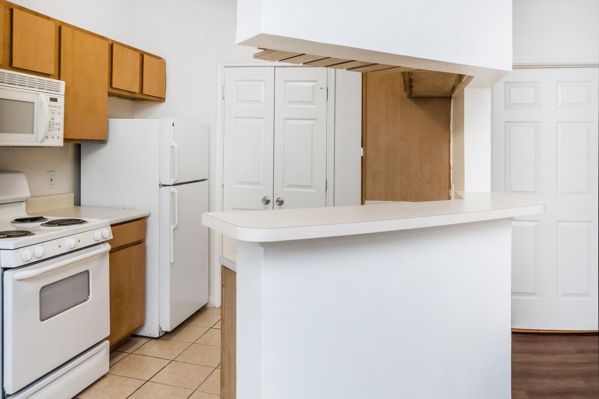 a white refrigerator freezer sitting inside of a kitchen