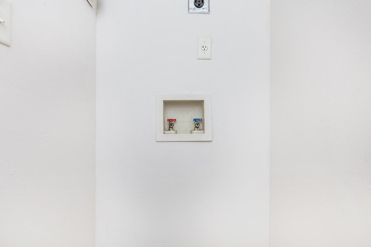 a white refrigerator freezer sitting in a room