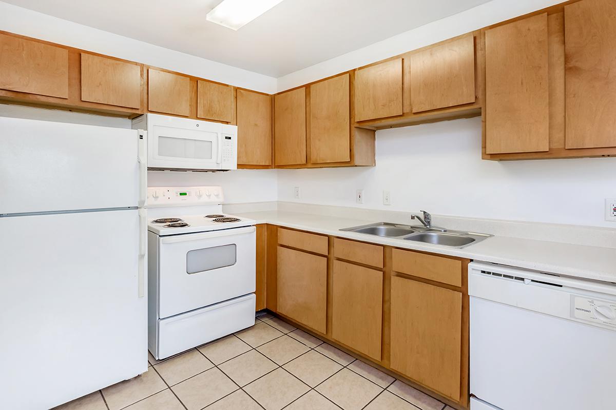 a kitchen with a stove and a refrigerator