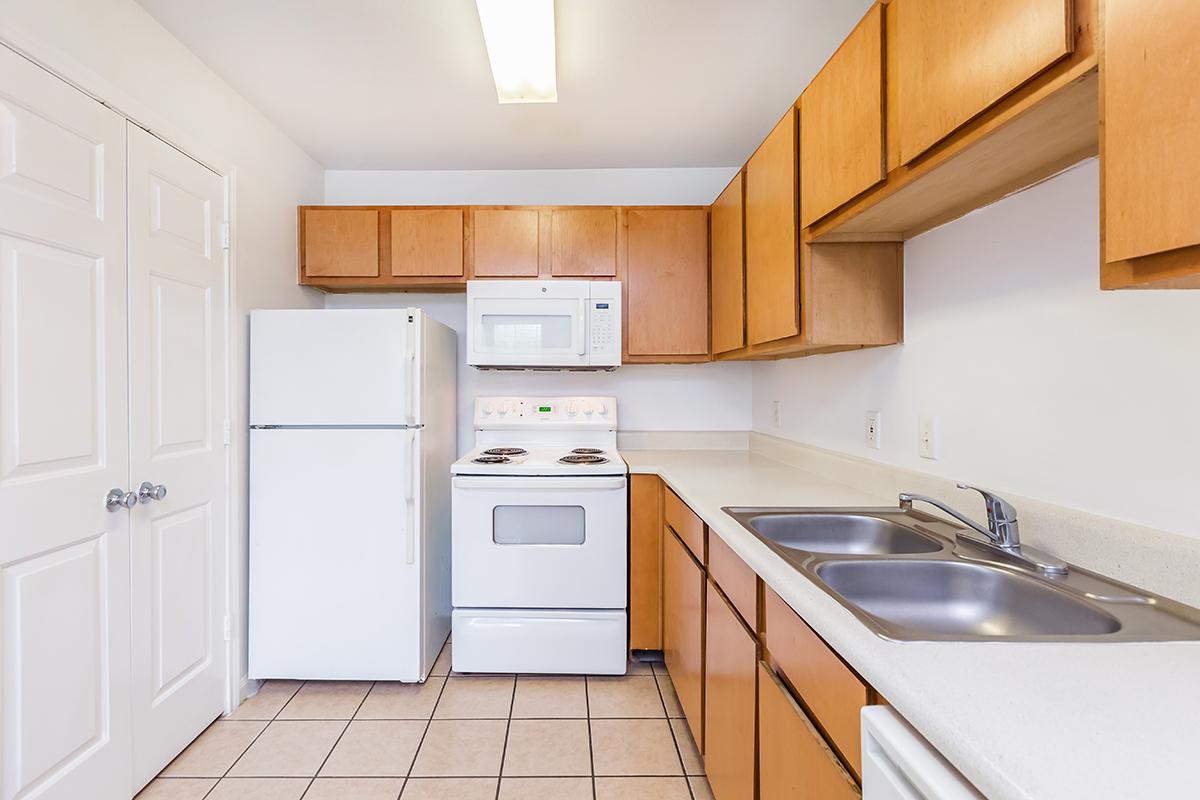 a kitchen with a stove top oven sitting inside of a refrigerator