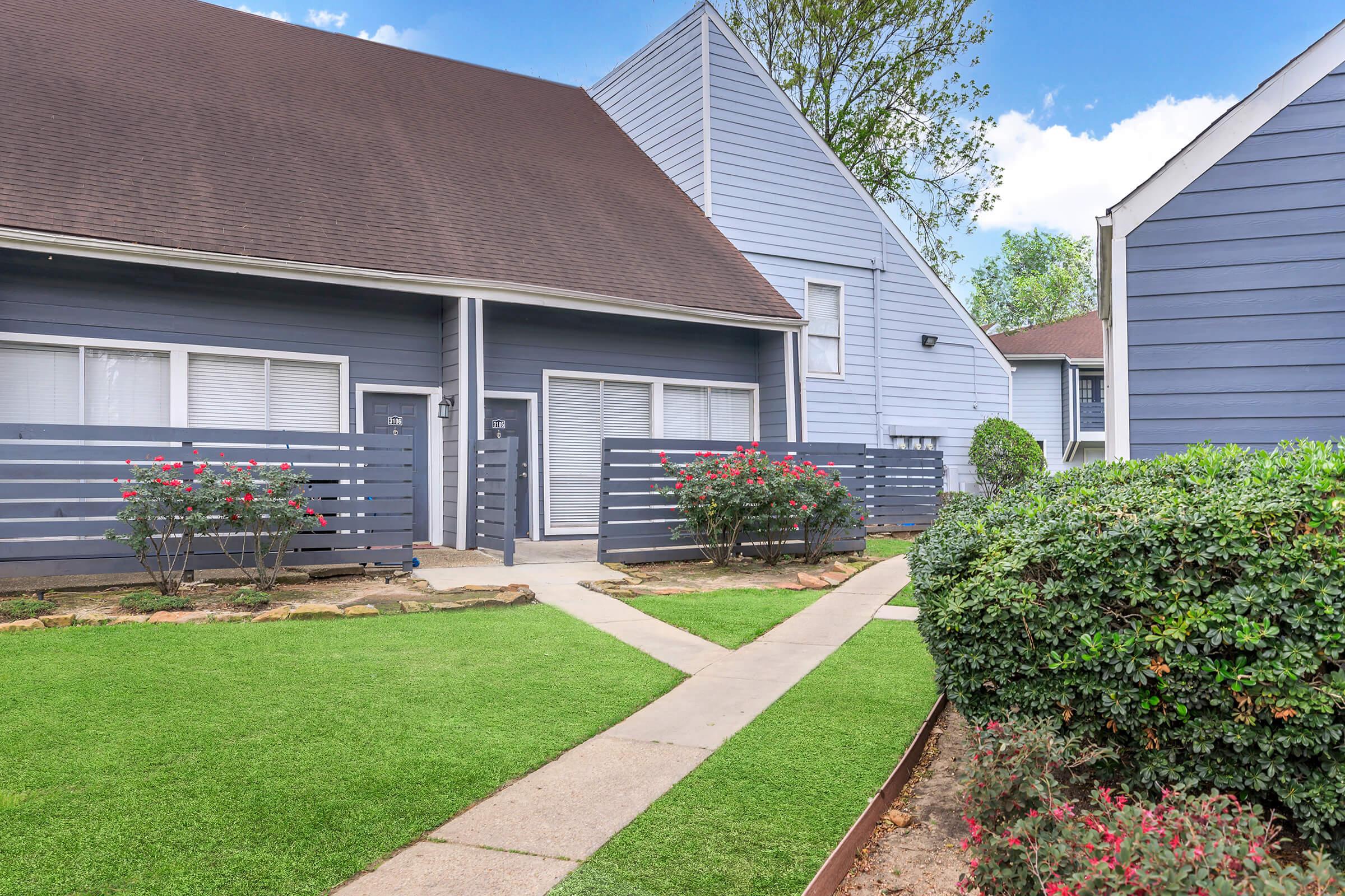 a large lawn in front of a house