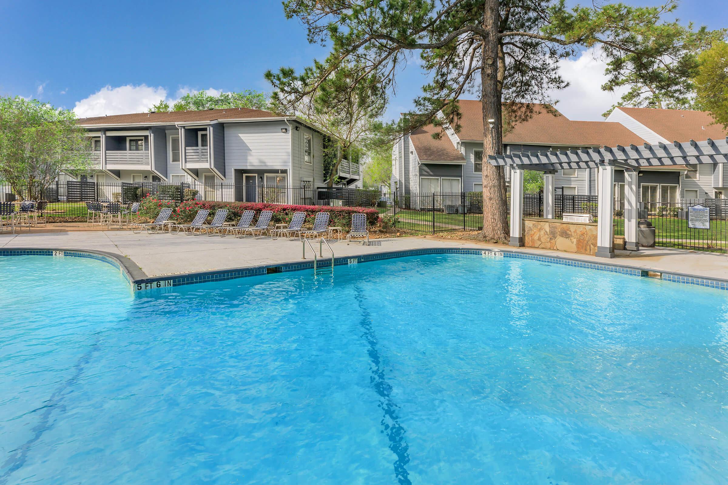 a house with a large pool of water