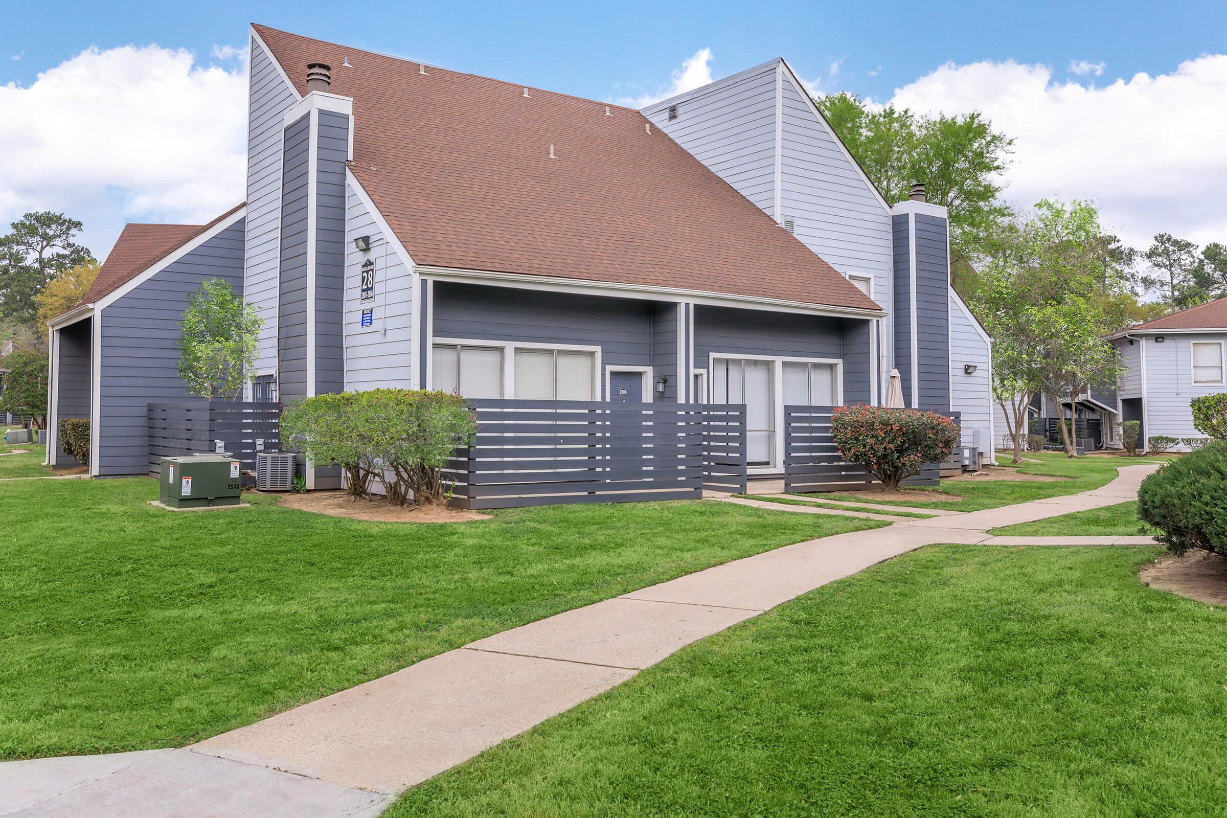 a large lawn in front of a house