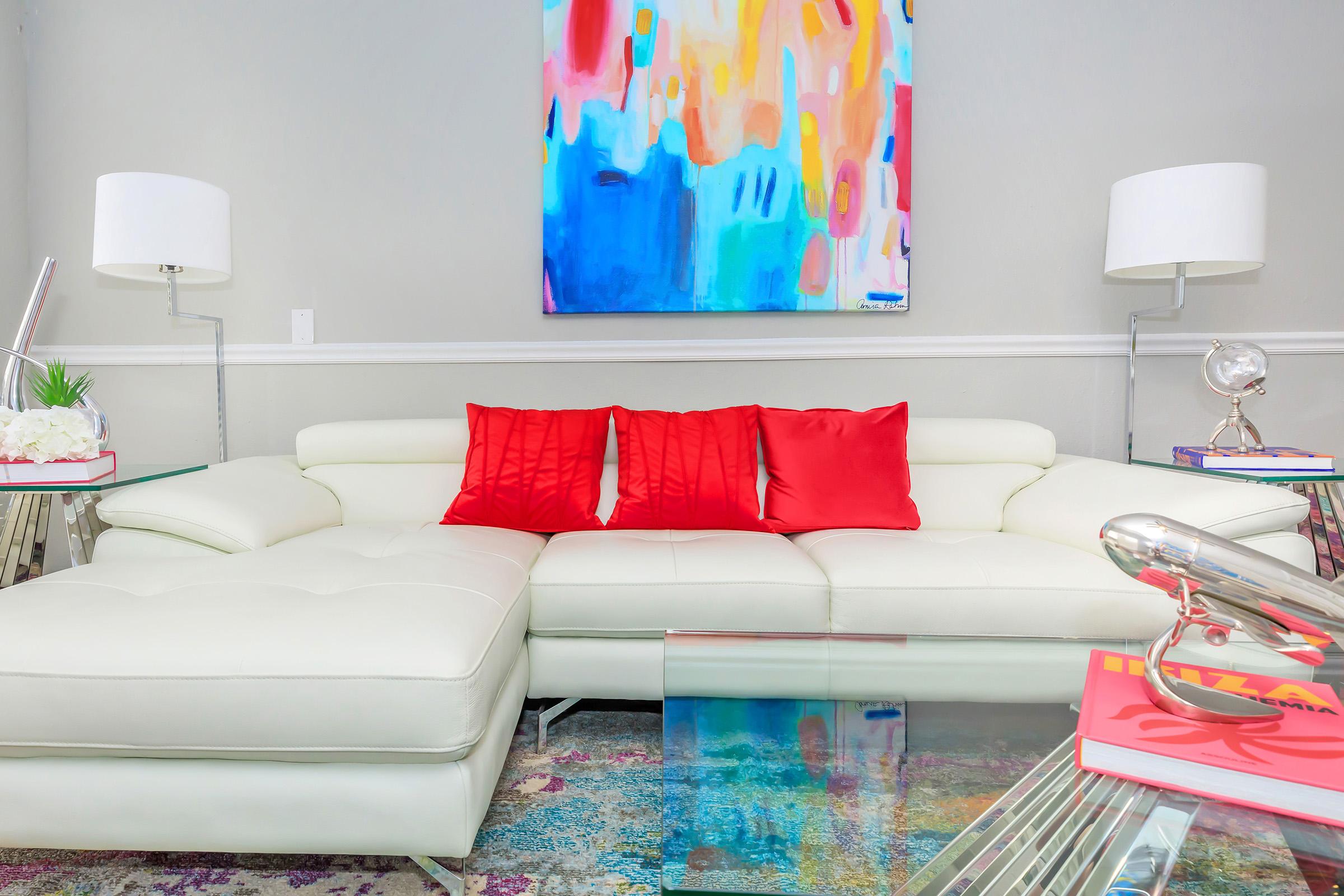 a colorful living room with a couch and a table