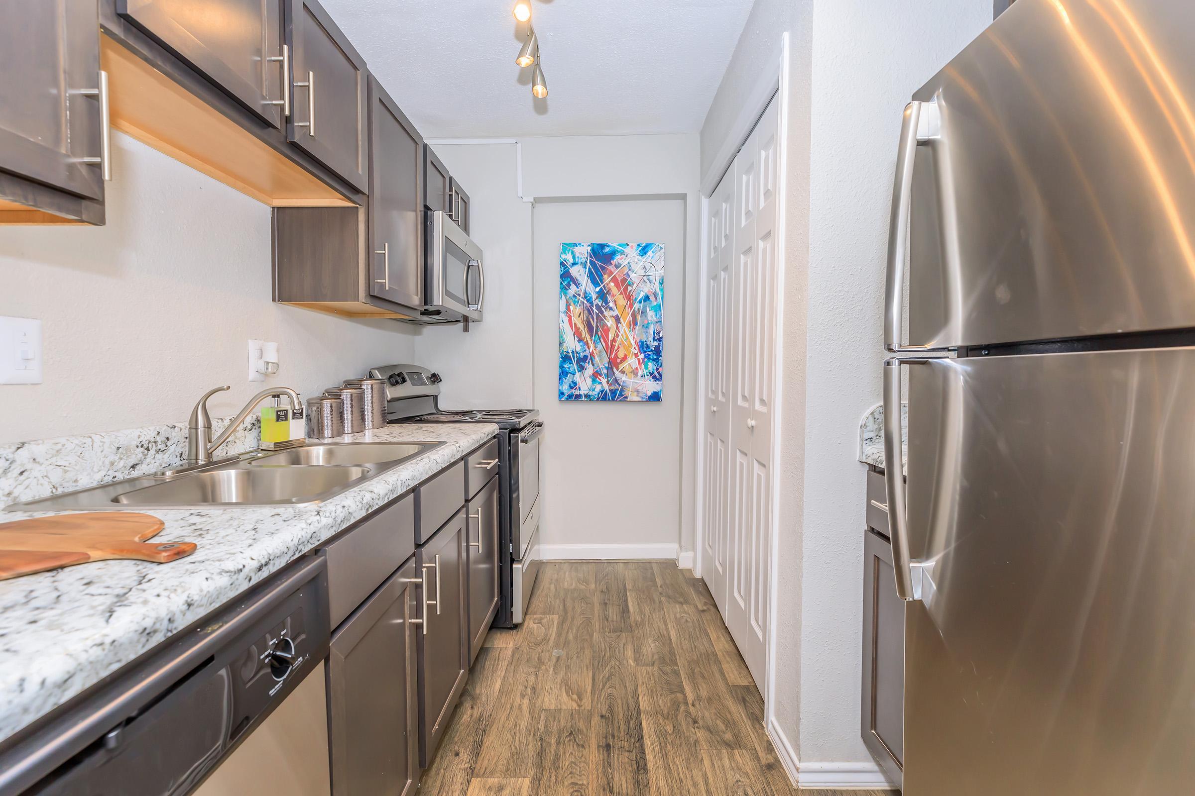 a stainless steel refrigerator in a kitchen