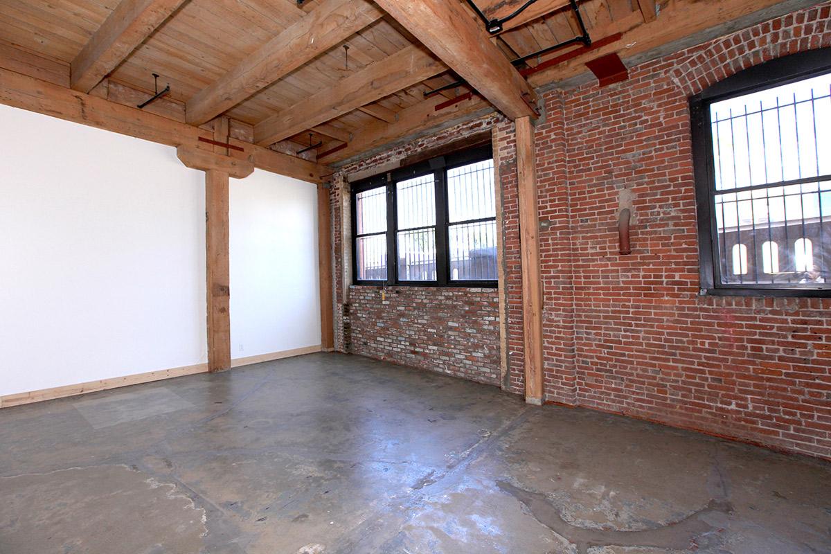 a large brick building with a window in a room