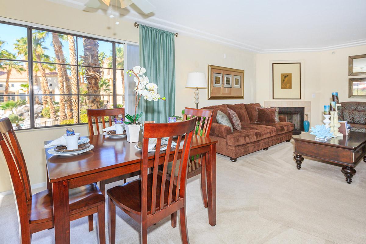 a living room filled with furniture and a table