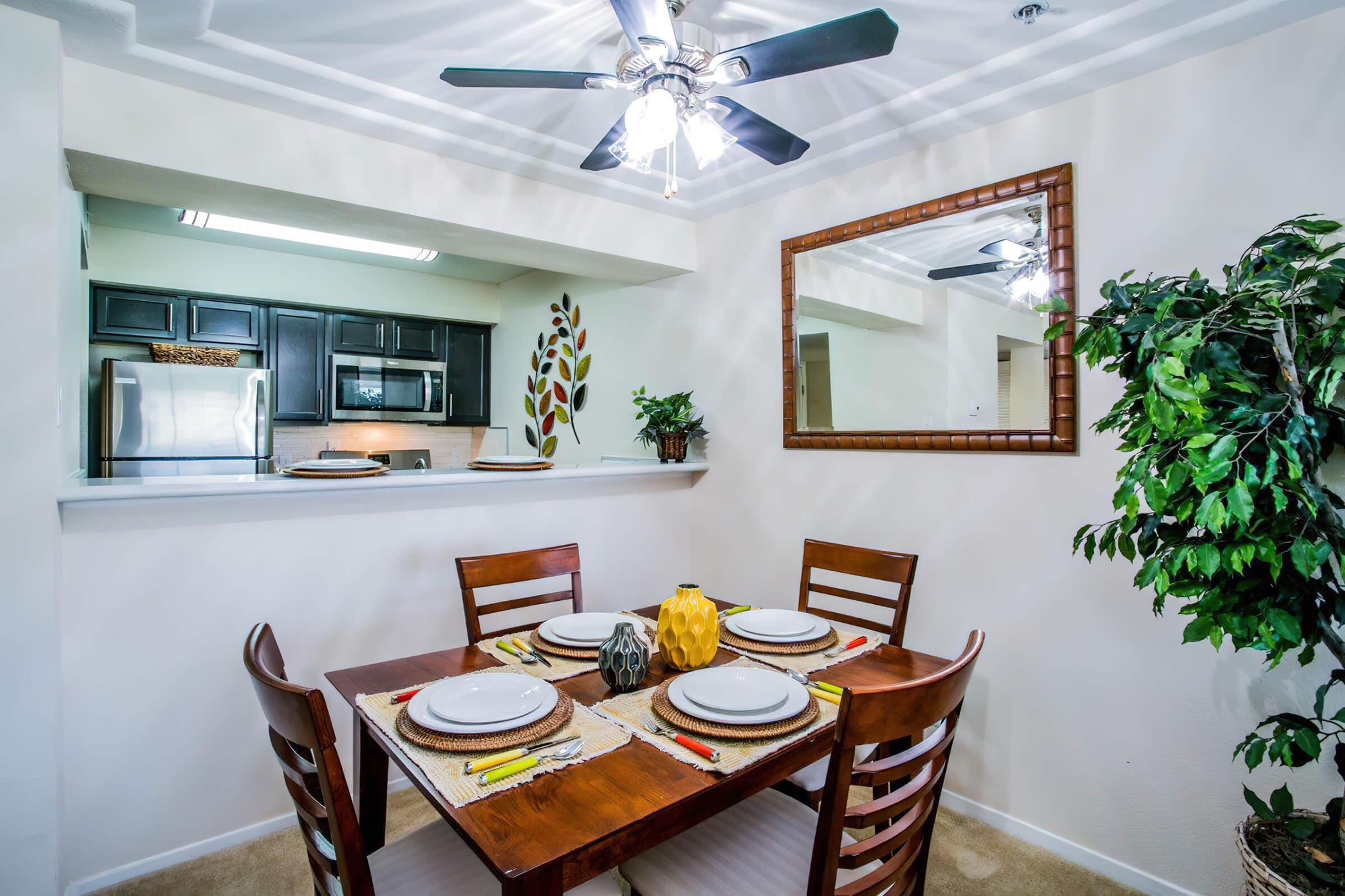 a dining room table in front of a window