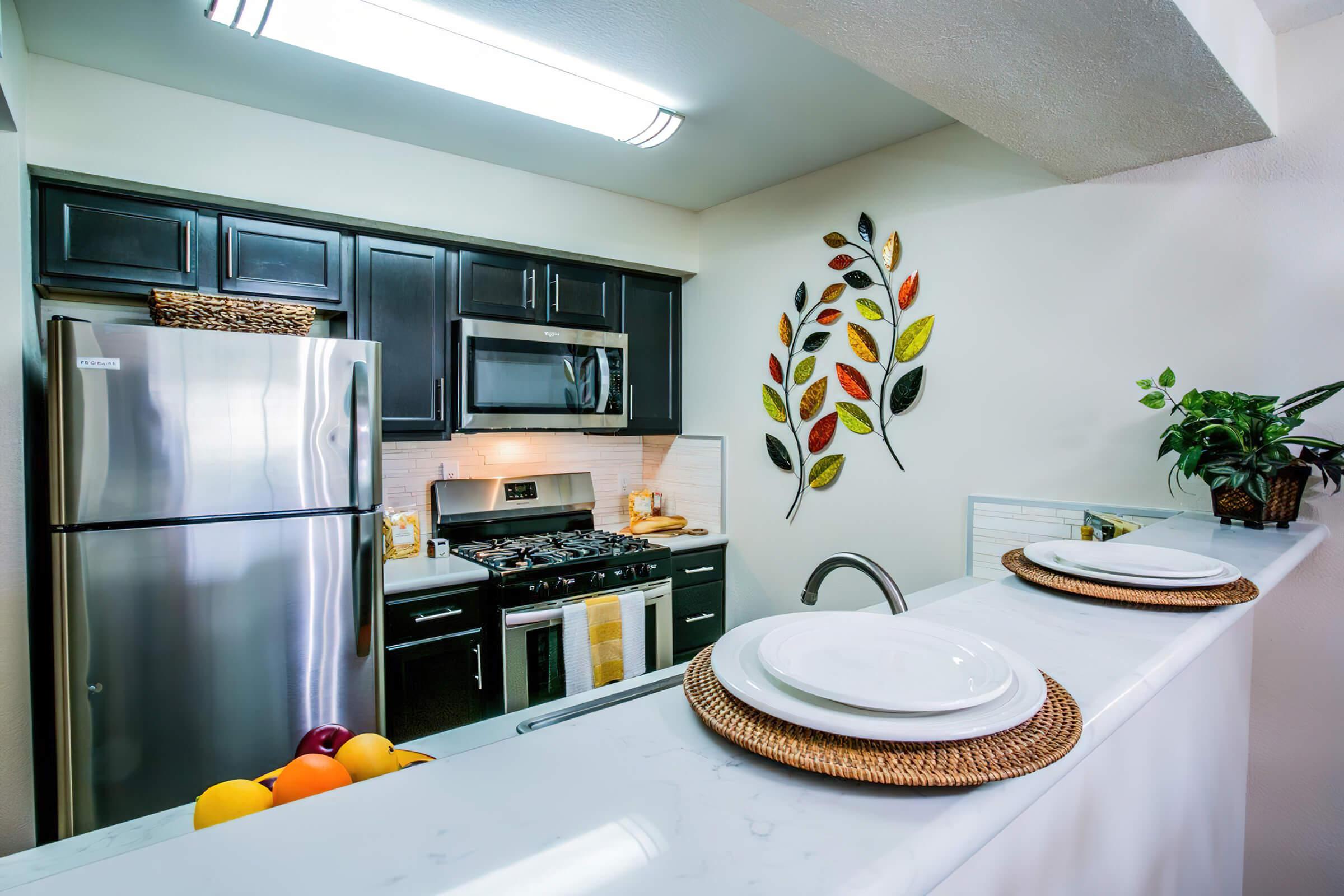 a kitchen with a sink and a microwave