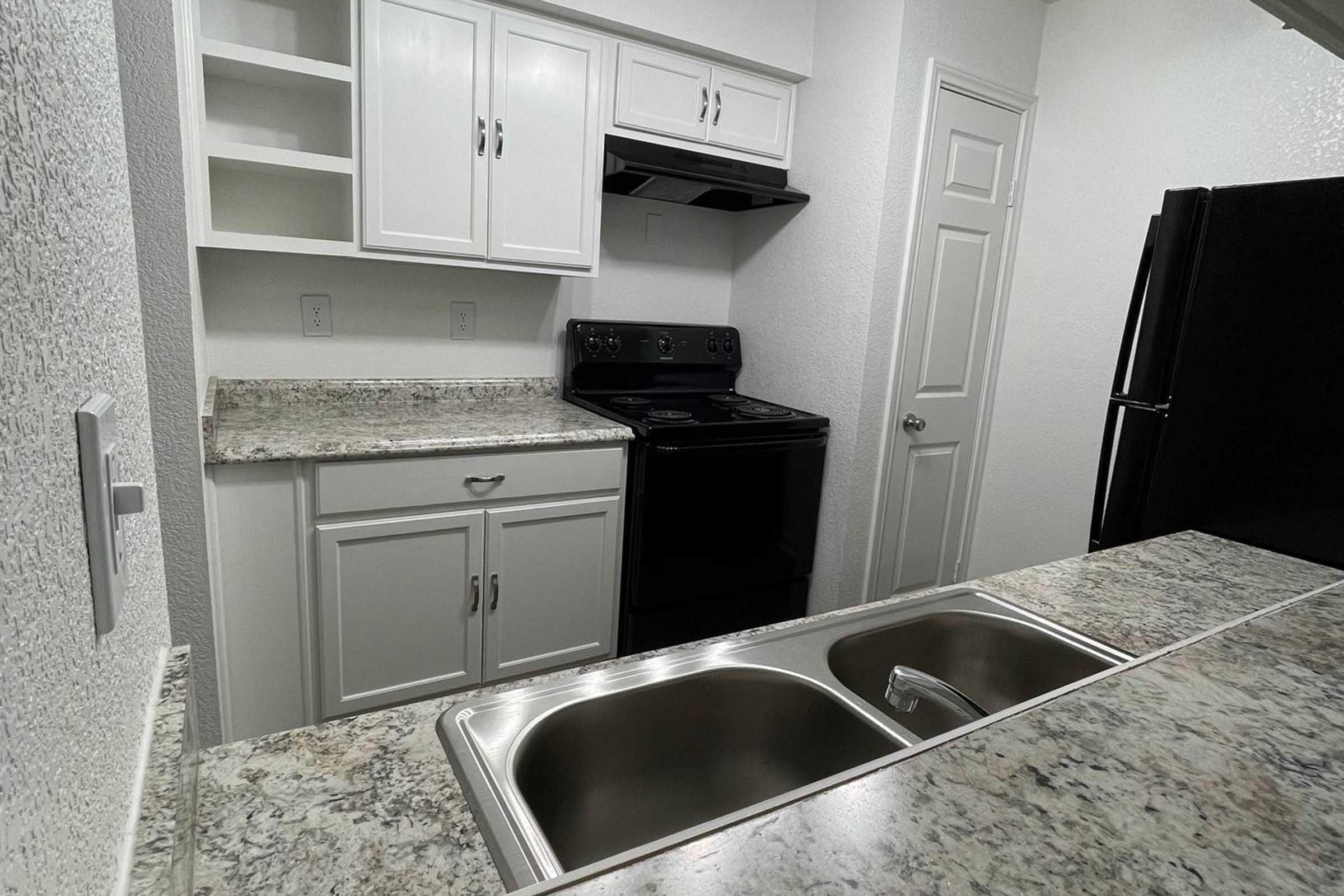 a kitchen with a stove and a sink