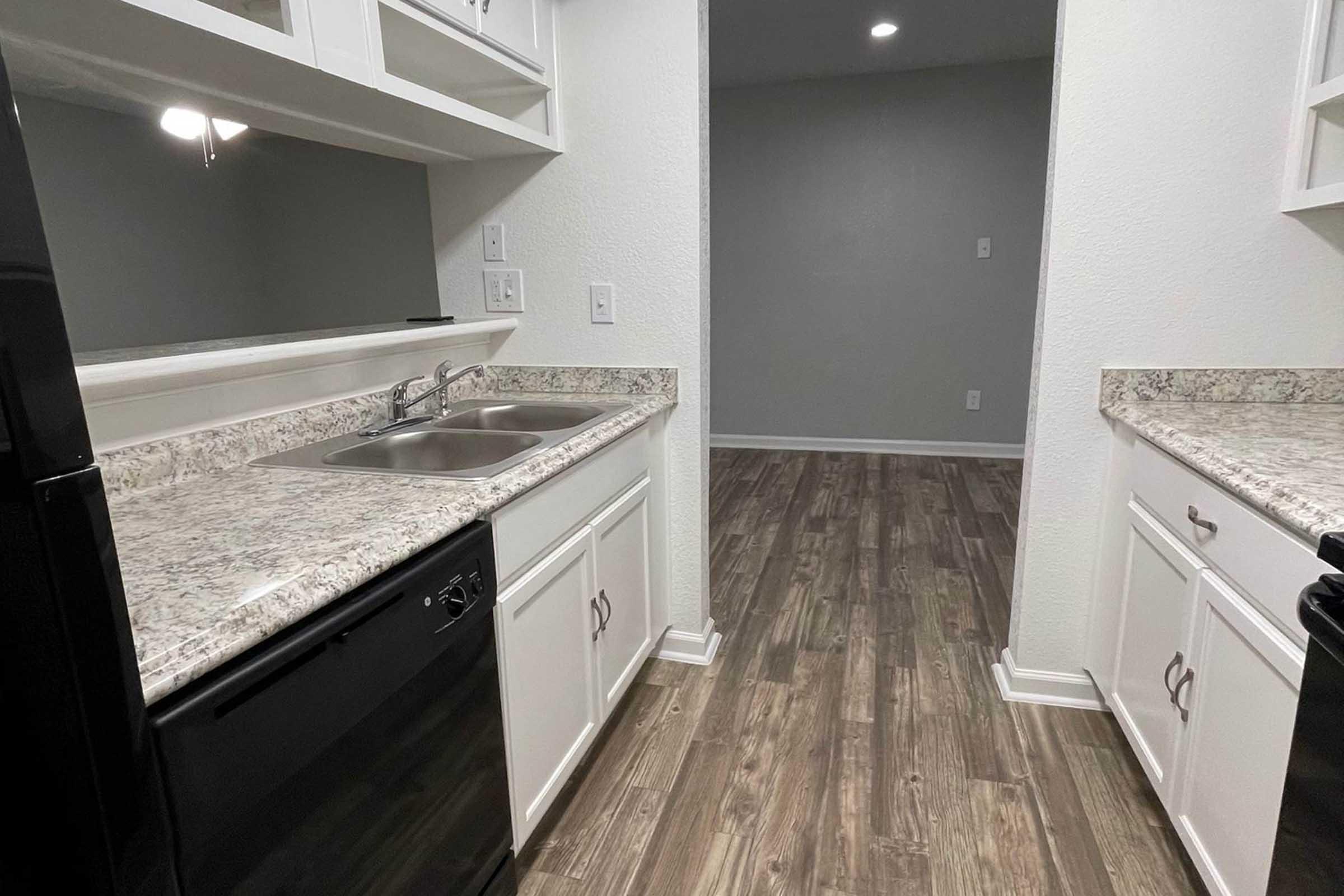 a kitchen with a stove and a sink