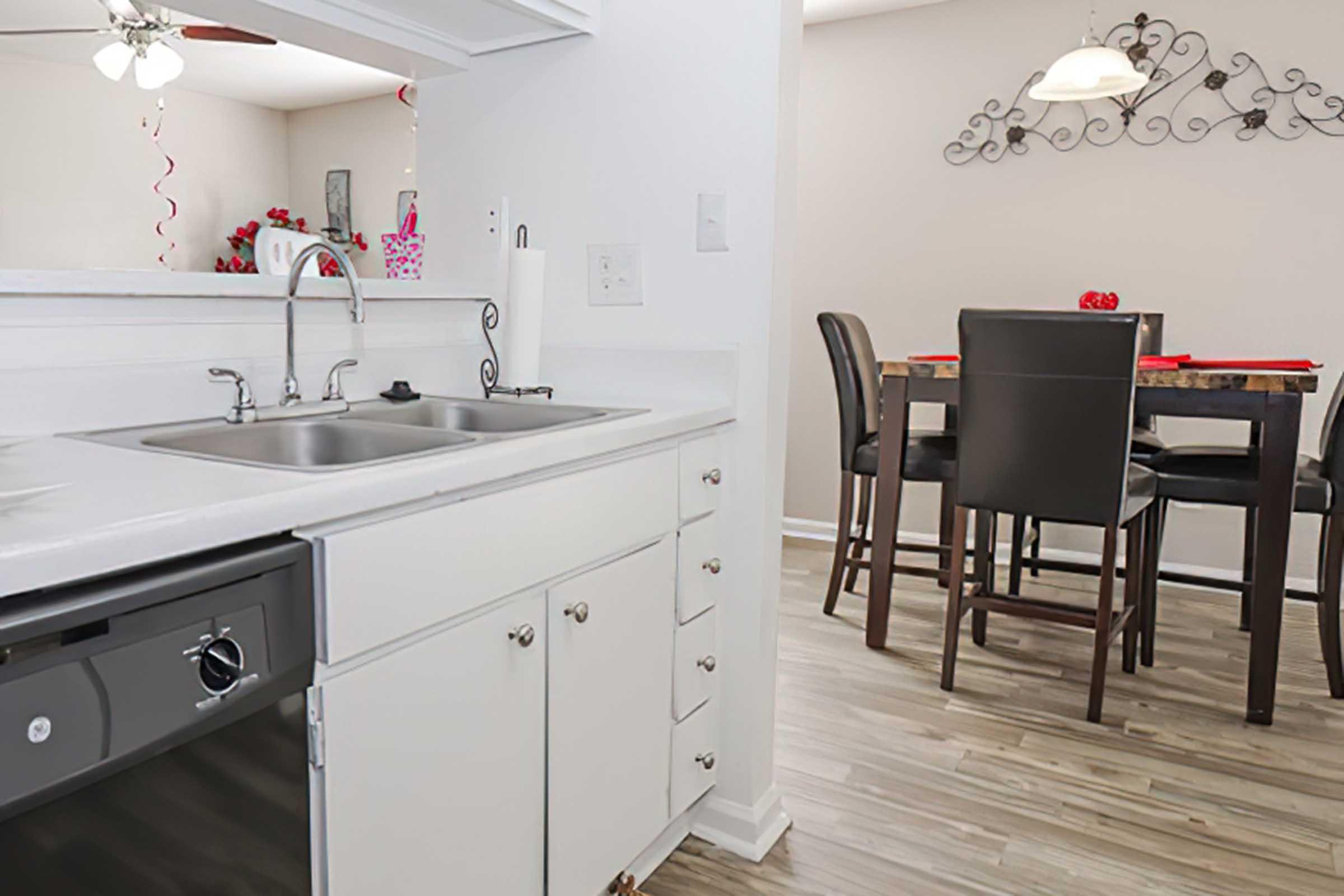 a kitchen with a stove and a sink