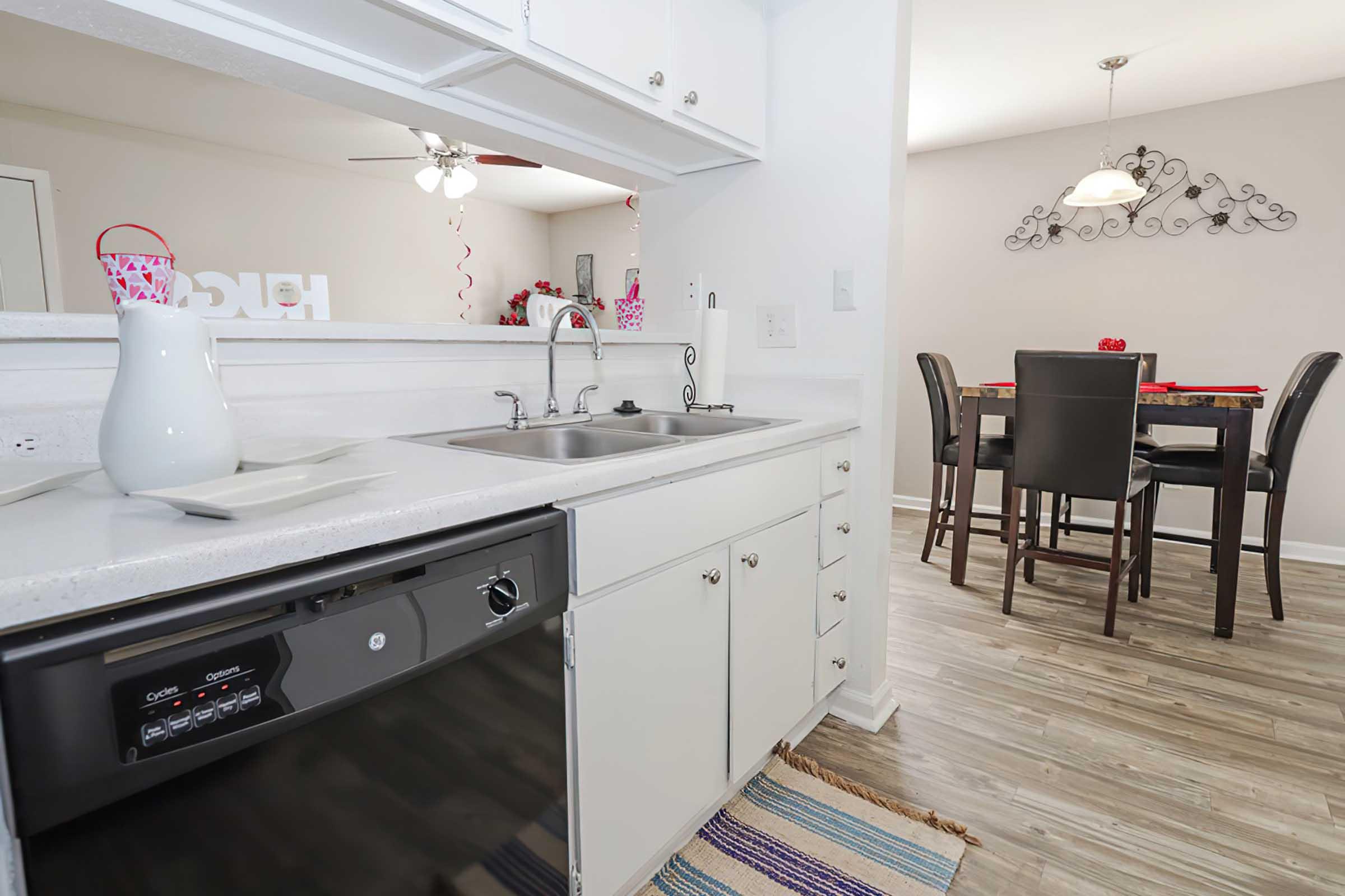 a kitchen with a stove top oven sitting inside of a room