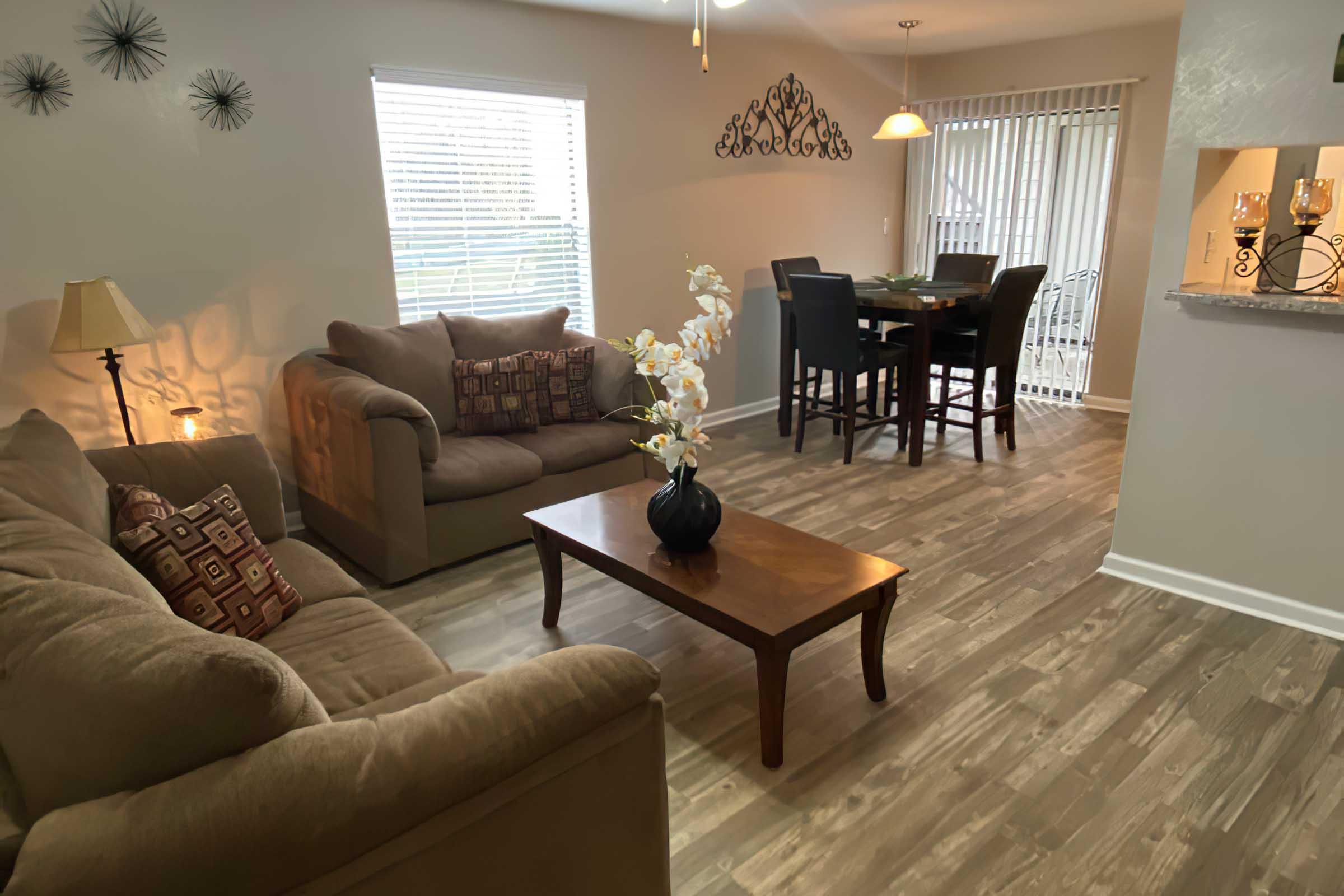 a living room filled with furniture and a fire place