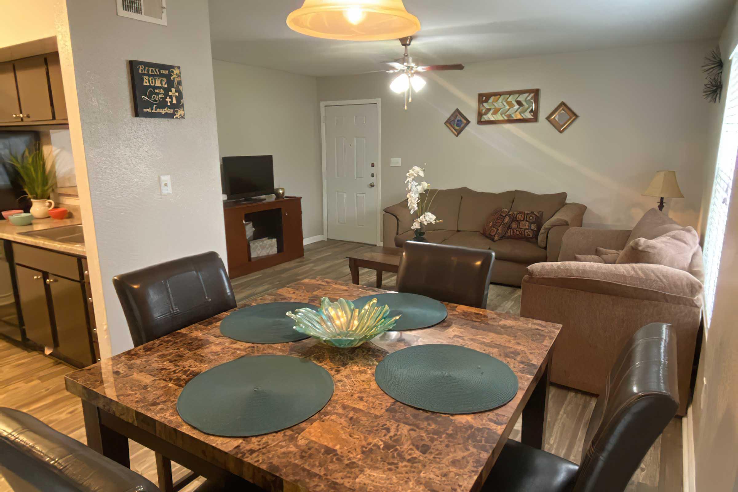 a living room filled with furniture and a table