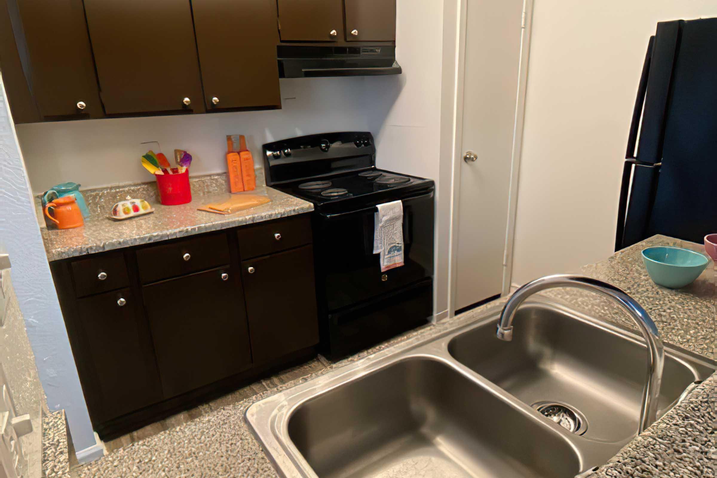 a kitchen with a stove and a sink