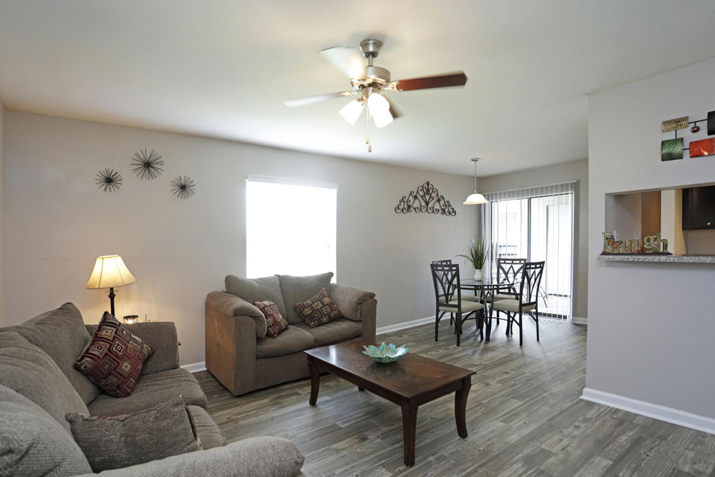 a living room filled with furniture and a table