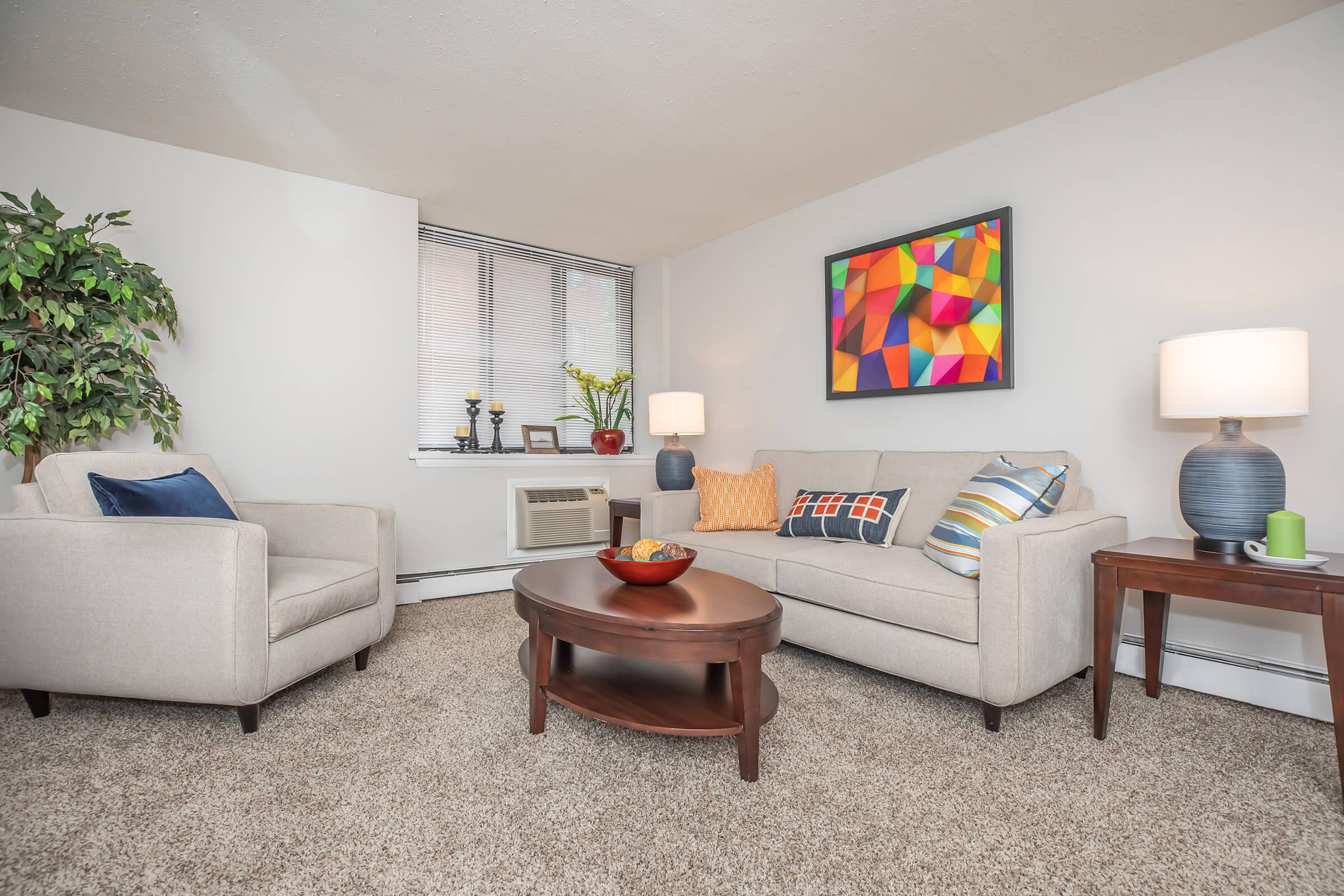 a living room filled with furniture and a flat screen tv
