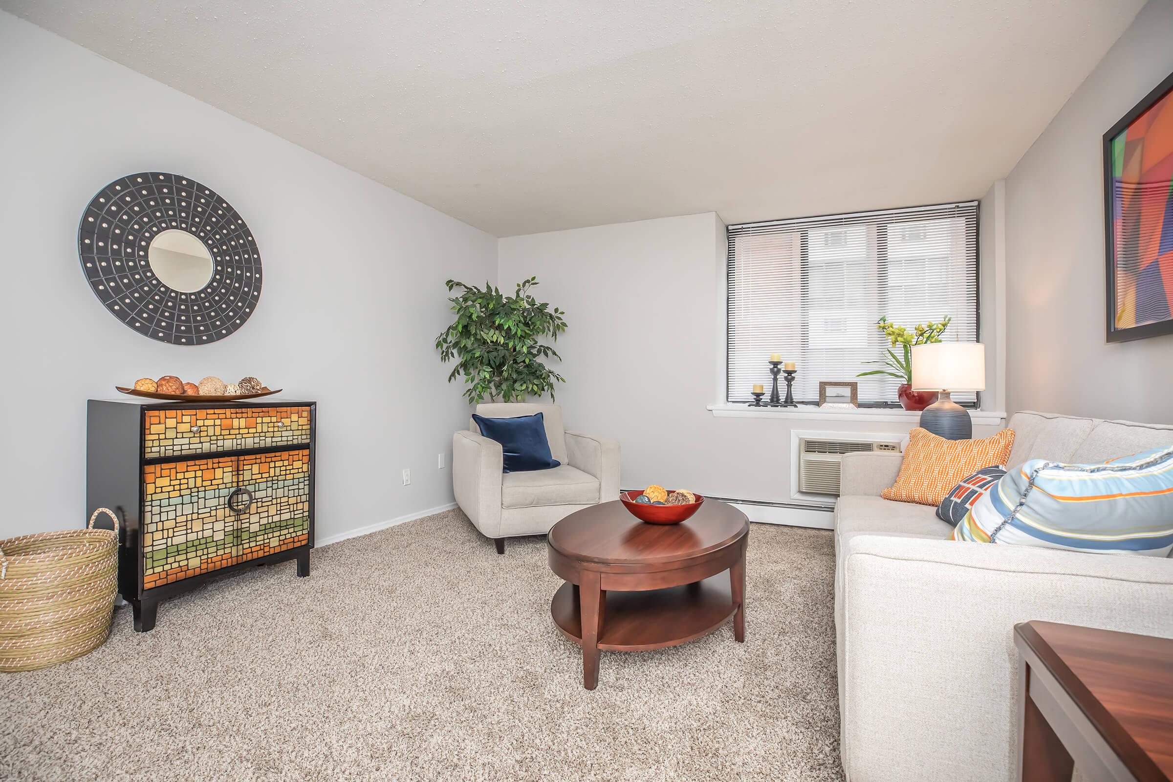 a living room filled with furniture and a fireplace