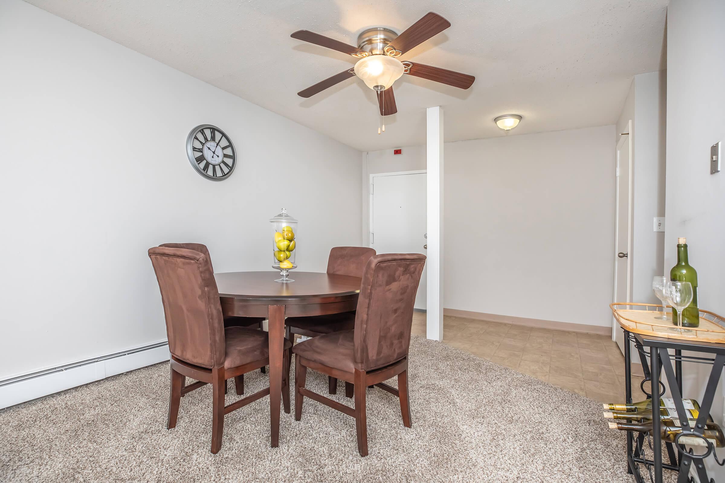 a living room filled with furniture and a table