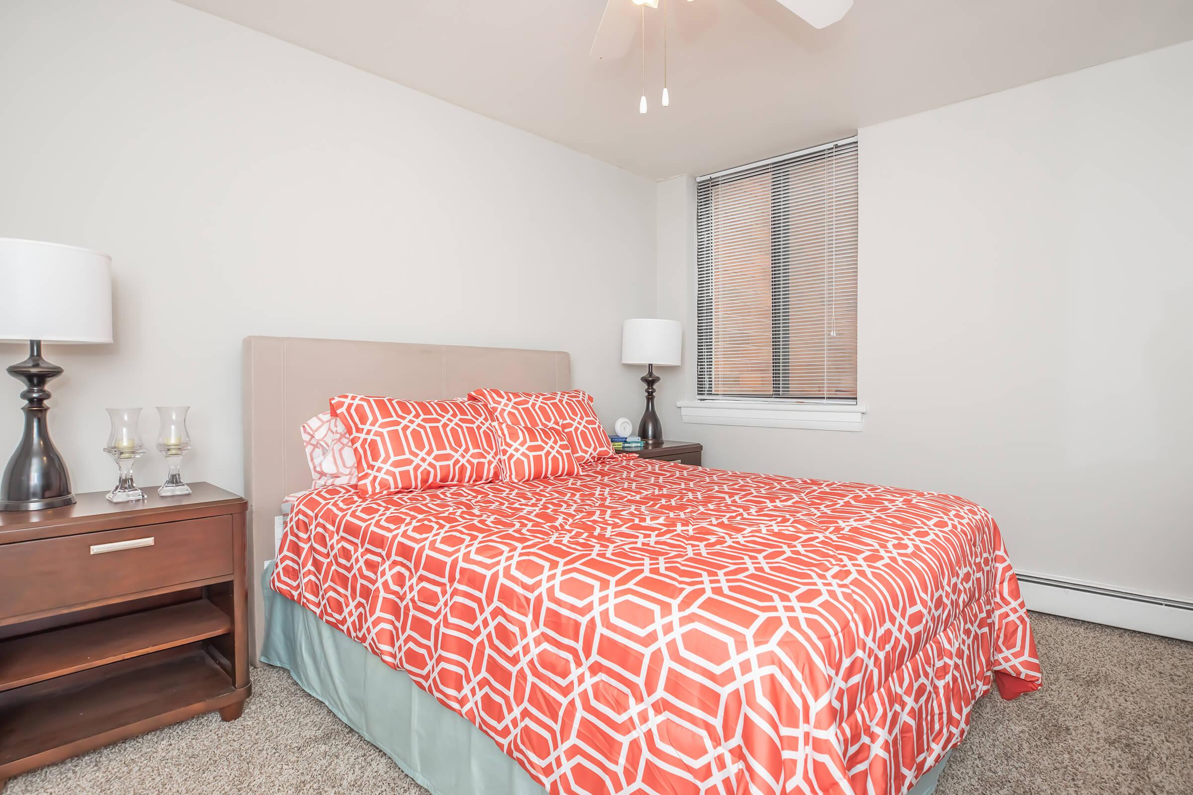 a bedroom with a bed in a room