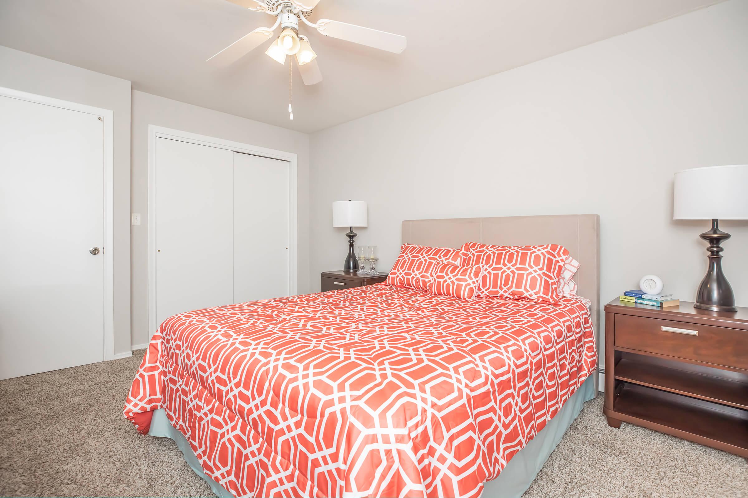 a bedroom with a bed in a room