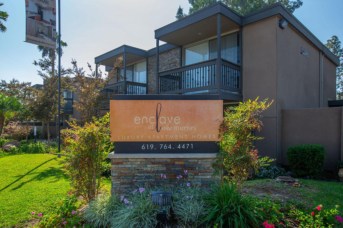 a house that has a sign on the side of a building