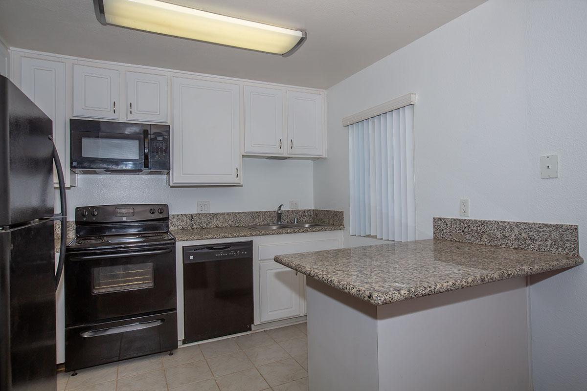 a kitchen with a sink and a microwave