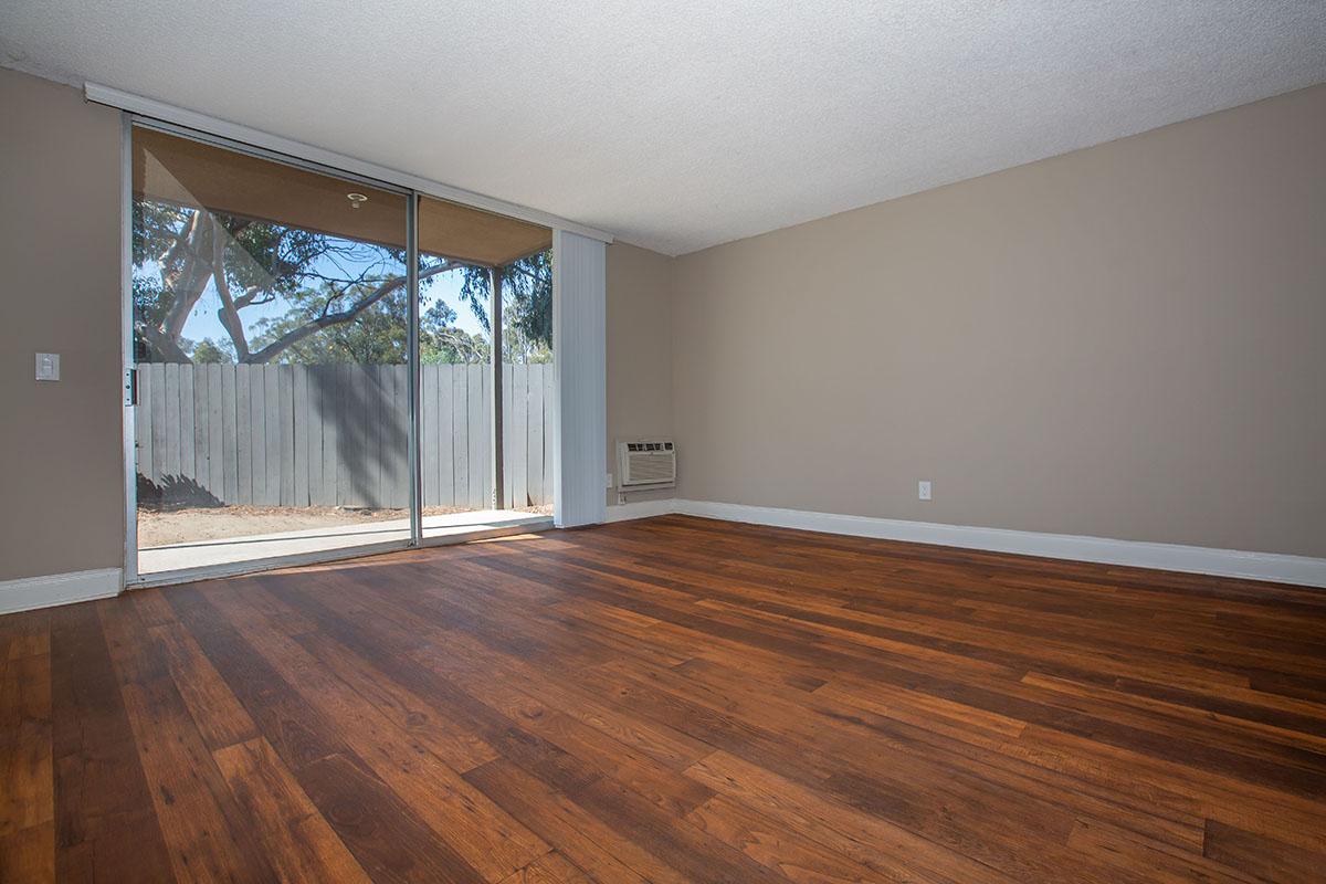 a large empty room with a wooden floor