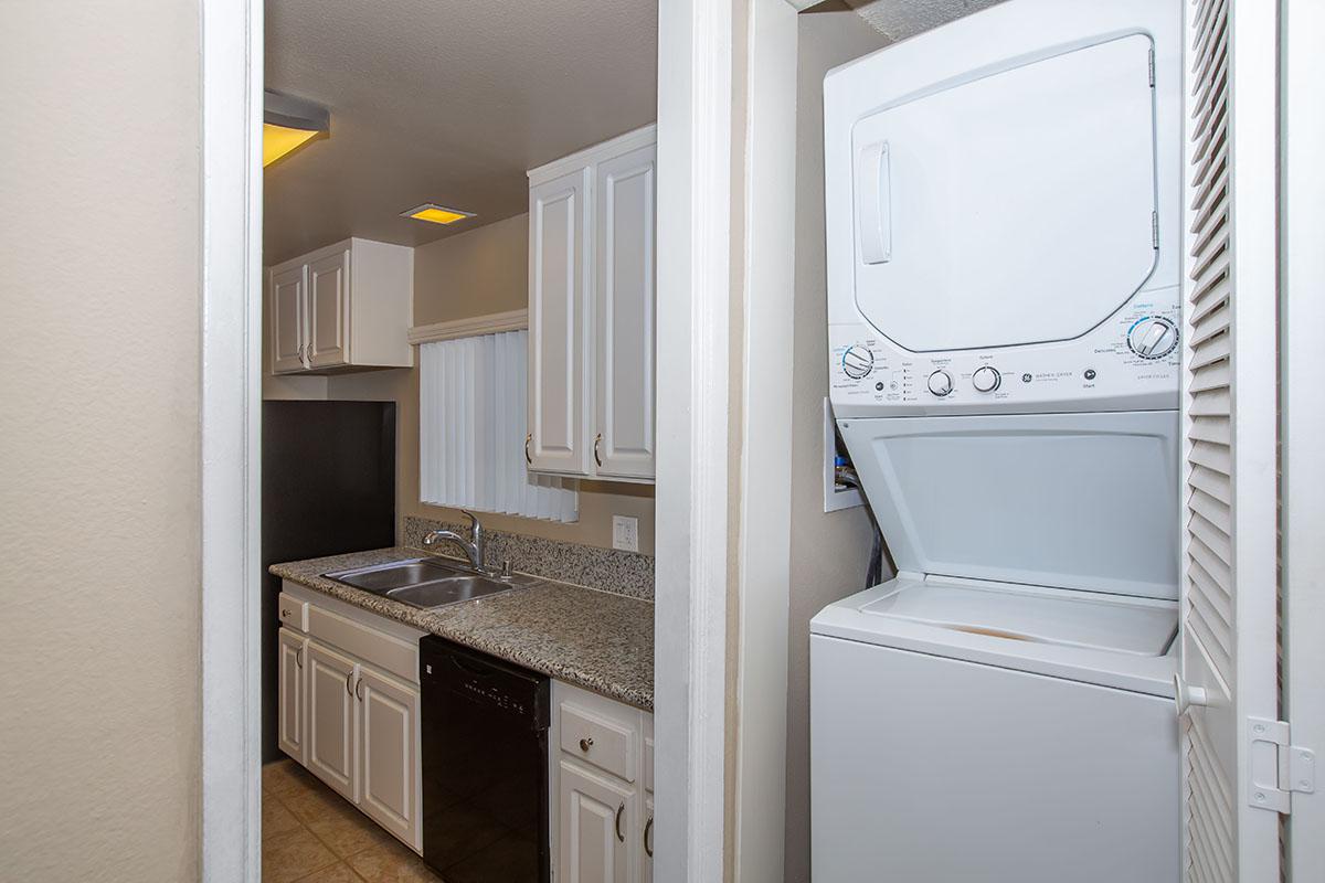 a white refrigerator freezer sitting next to a window