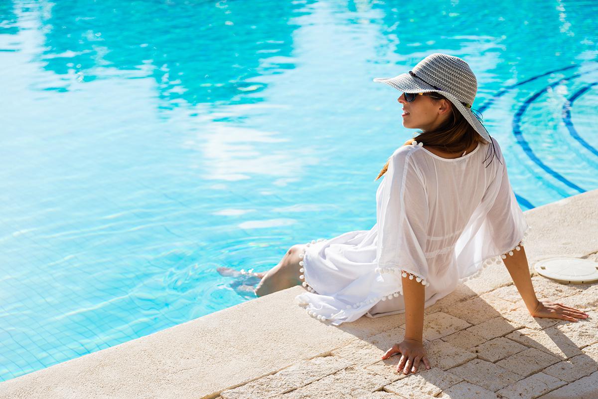 woman relaxing poolside.jpg