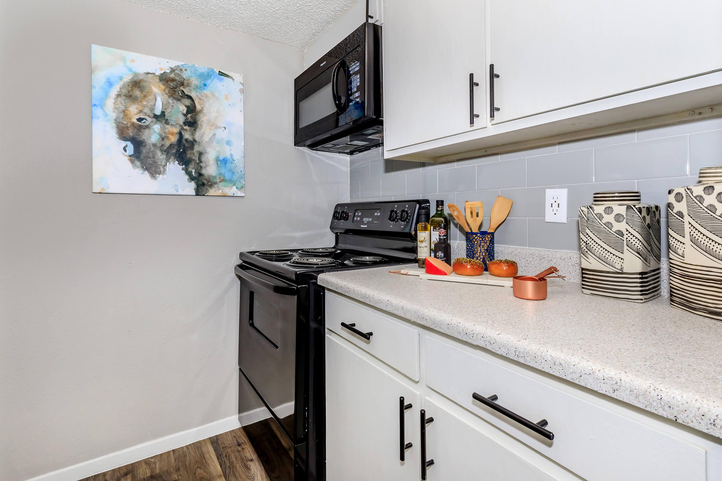 a kitchen with a sink and a mirror