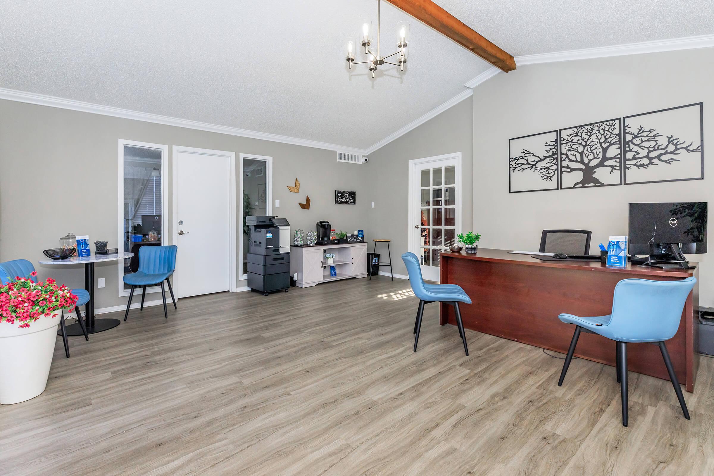 a living room filled with furniture and a table