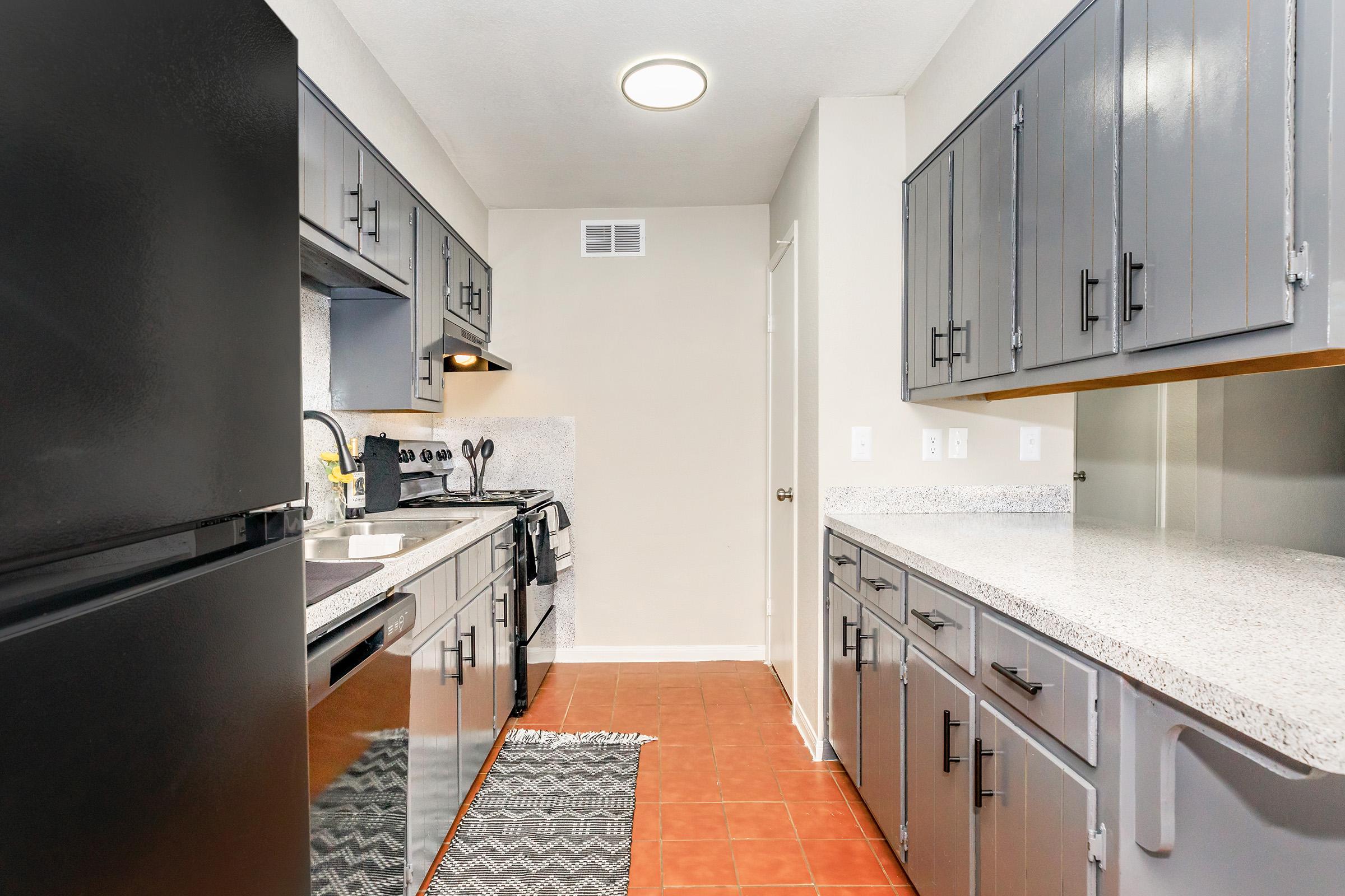 a large kitchen with stainless steel appliances