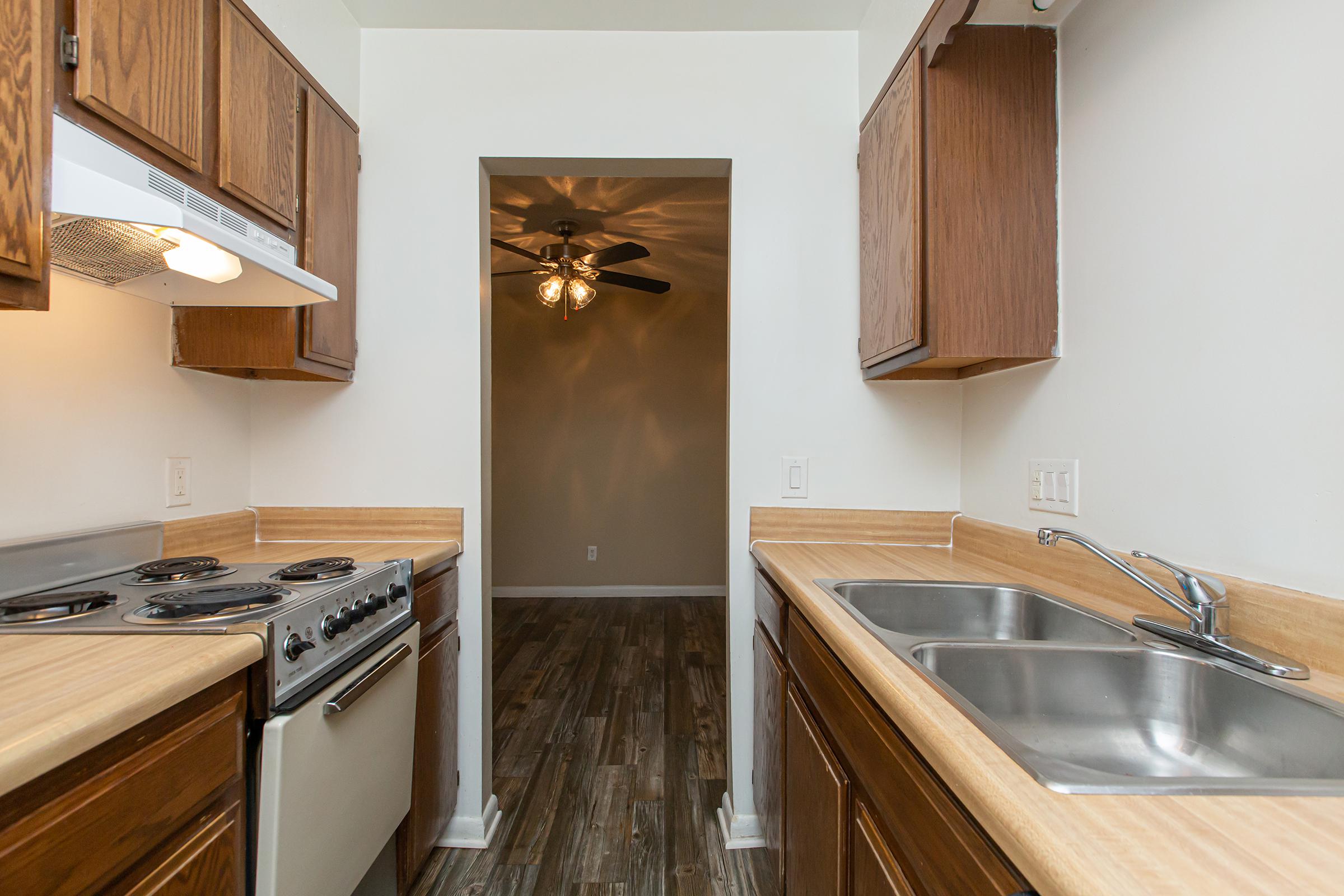 a kitchen with a stove and a sink