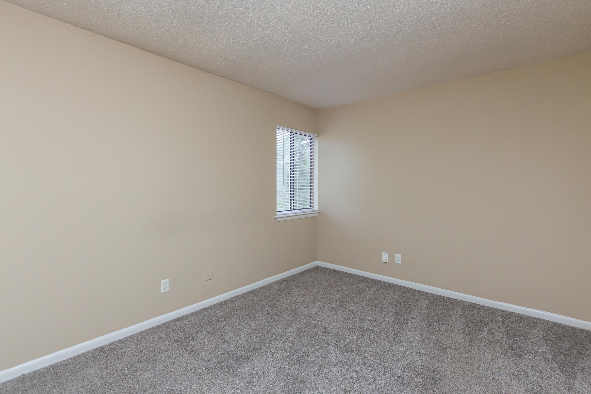 a bedroom with a large mirror