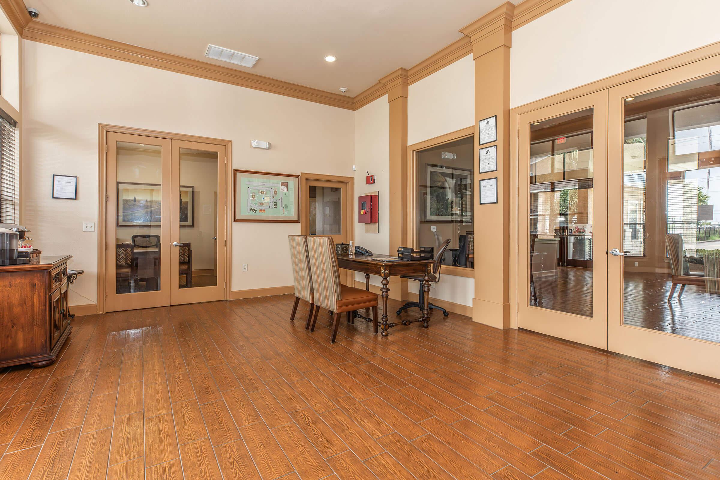 a living room filled with furniture and a large window