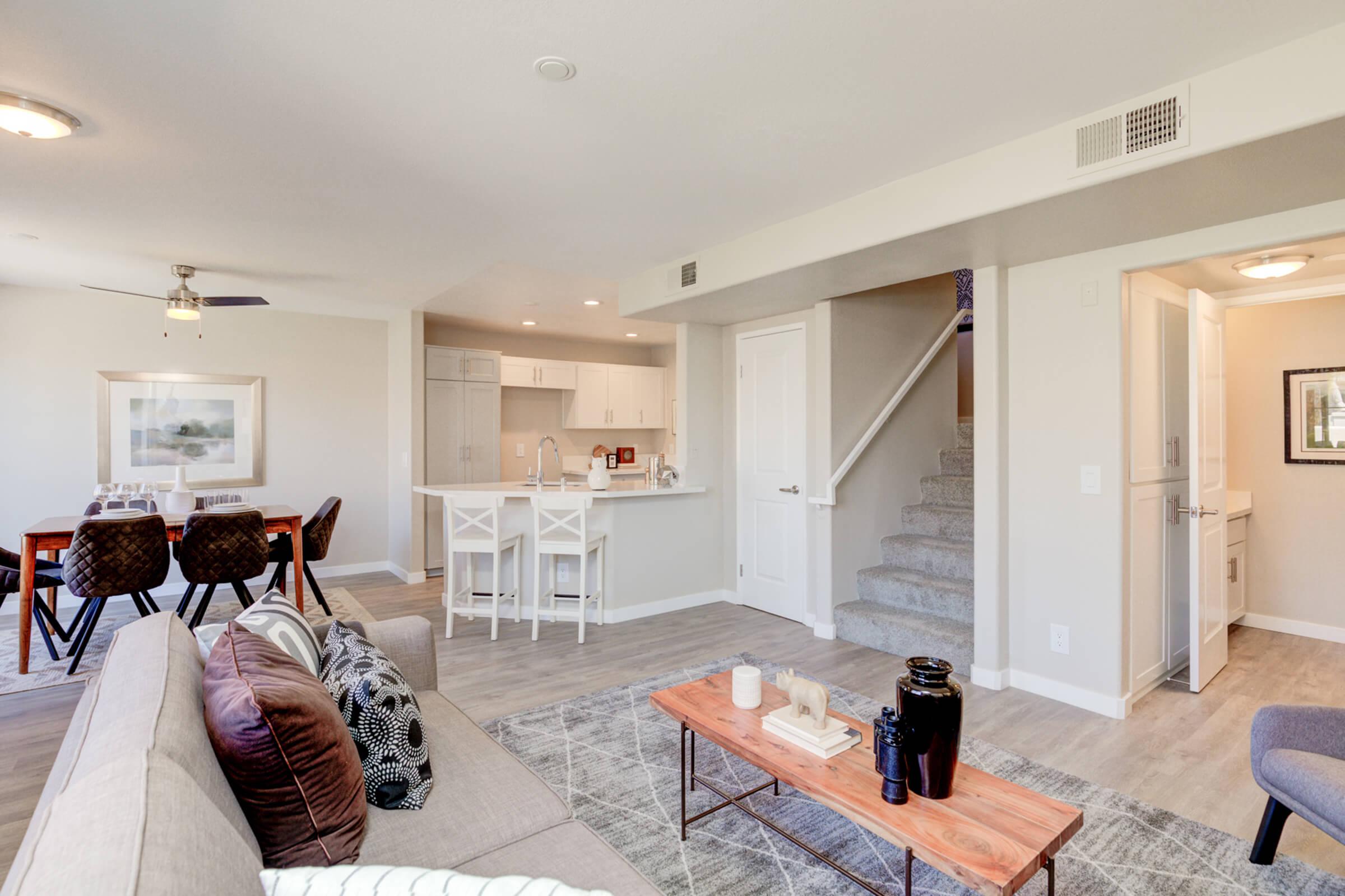 a living room filled with furniture and a fireplace