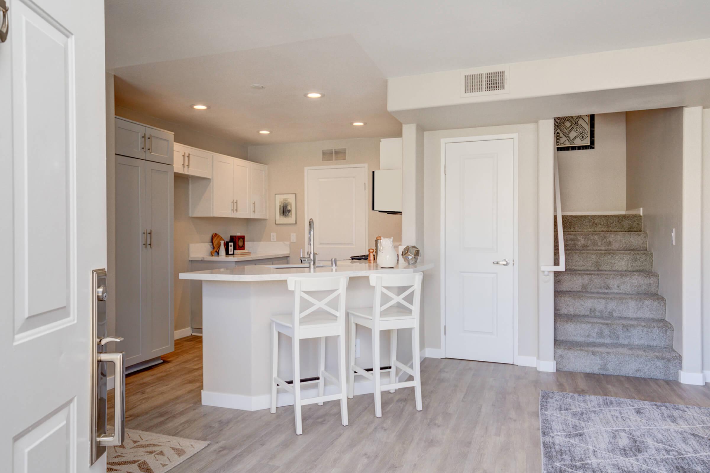 a kitchen with a wood floor