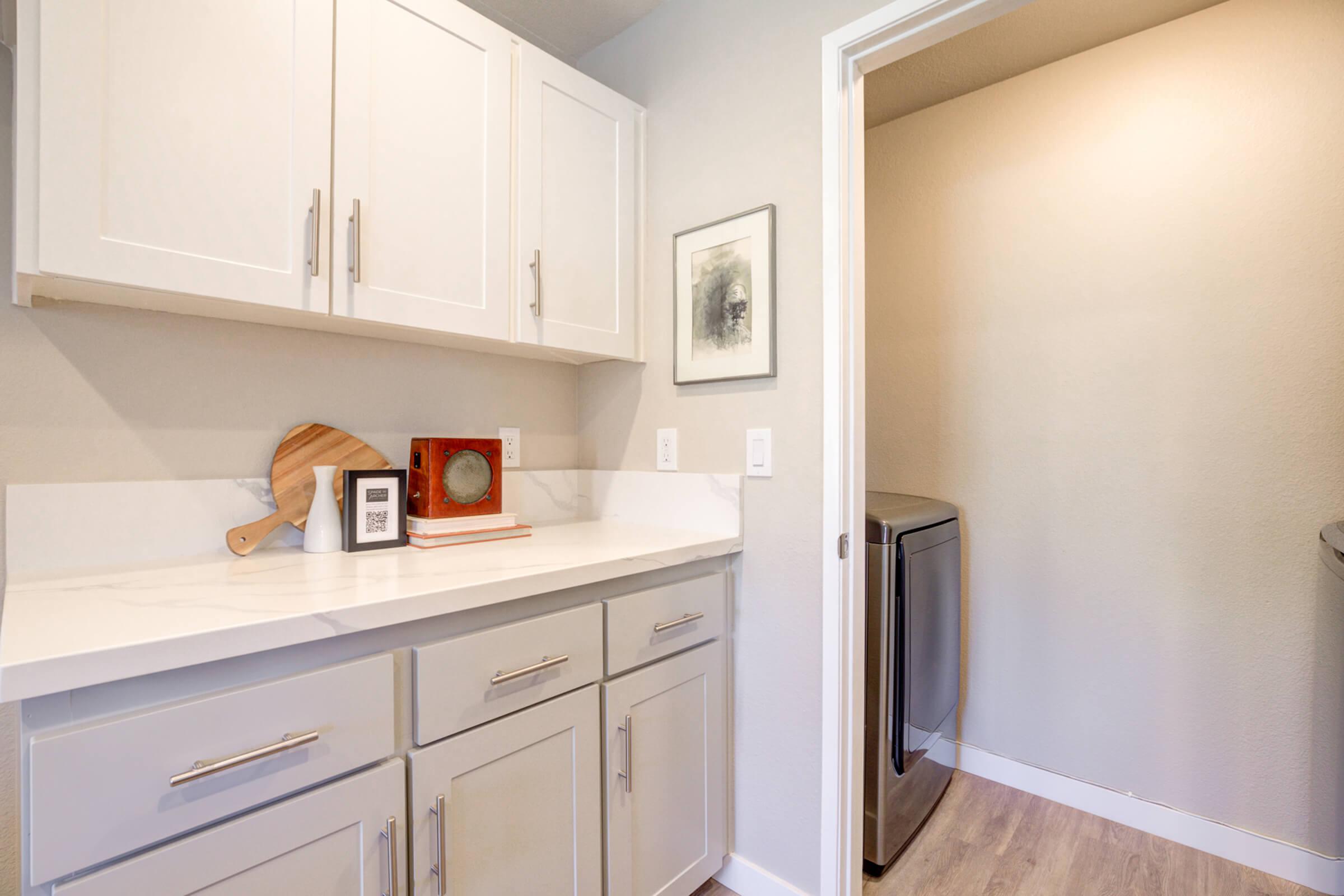 a kitchen with a sink and a microwave