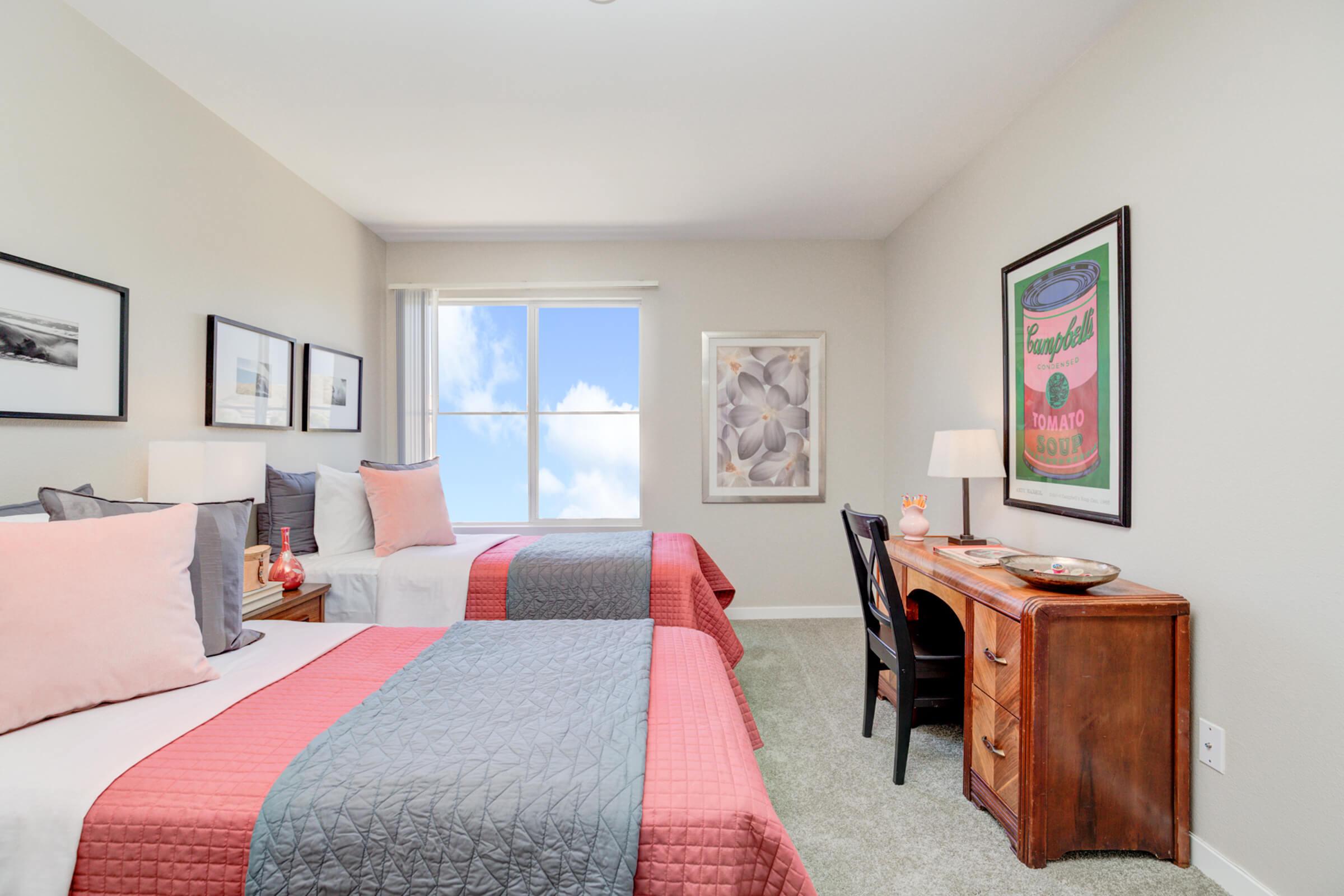 a bedroom with a large bed in a hotel room