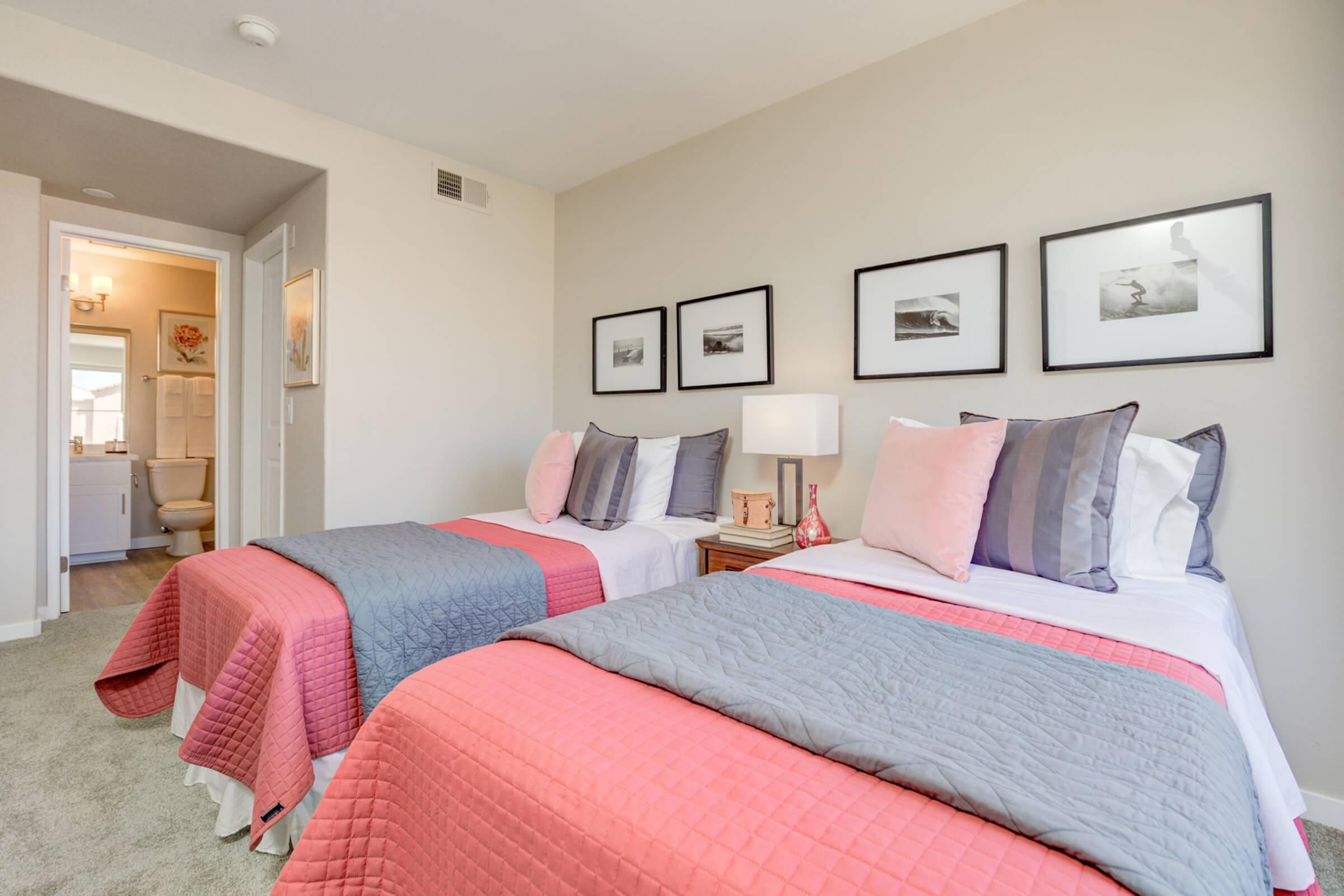 a bedroom with a large bed in a hotel room