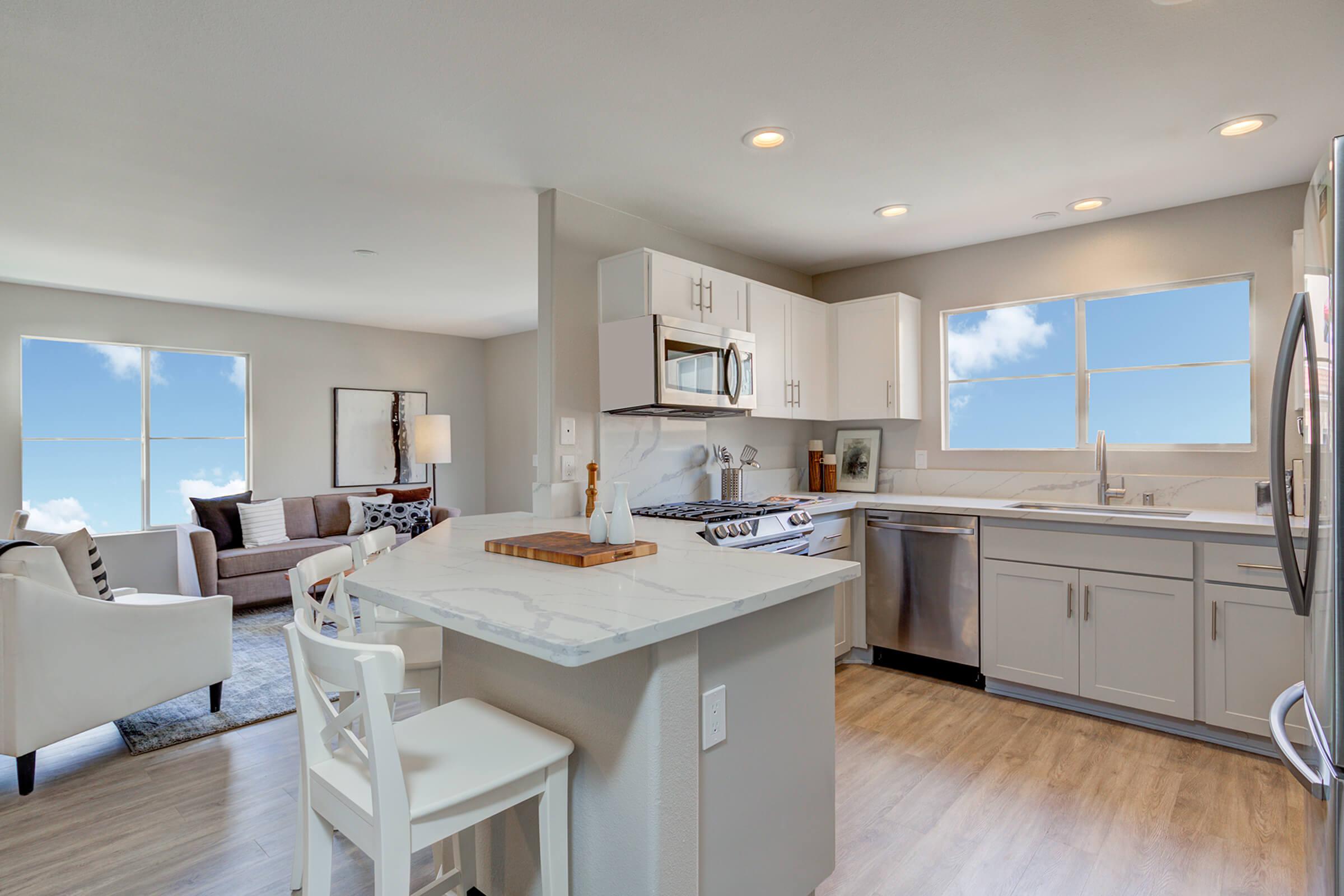 a kitchen with an island in the middle of a room