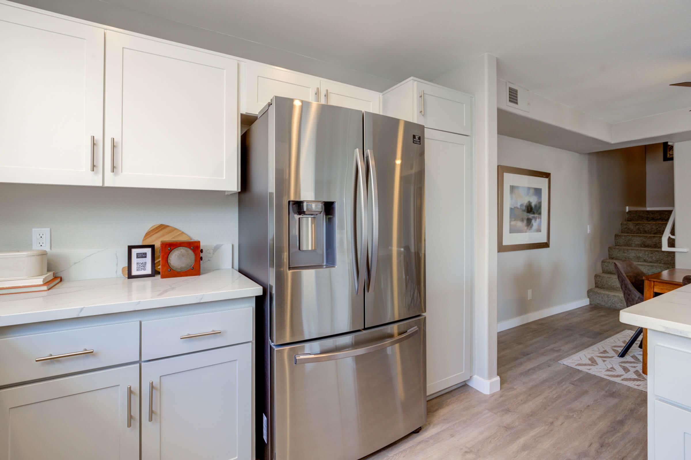 a stainless steel refrigerator in a kitchen